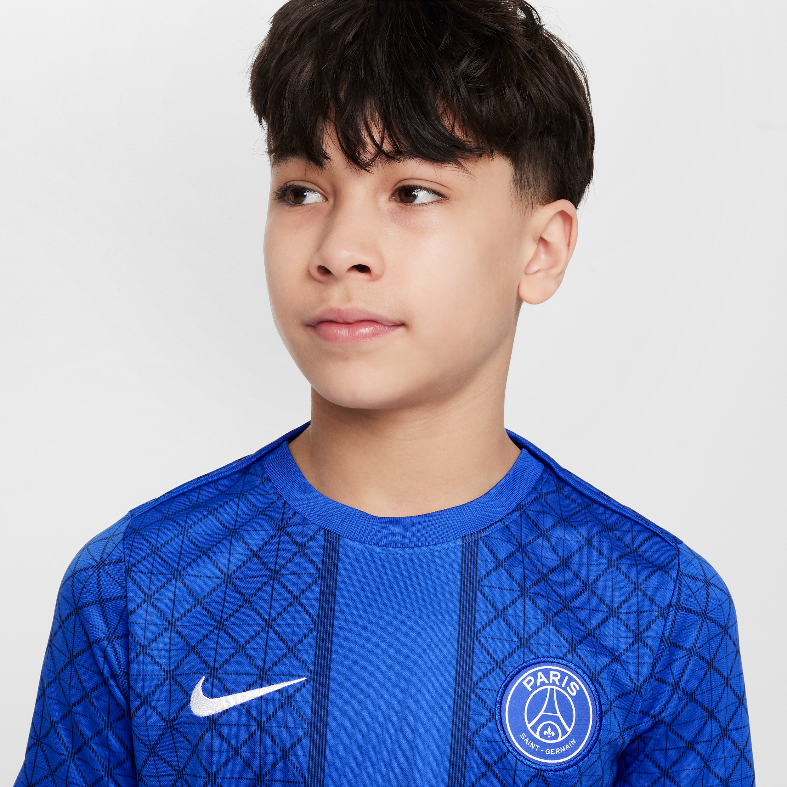 Thumbnail - Paris Saint-Germain Academy Pro Home Nike Dri-FIT kurzärmeliges Pre-Match-Fußballoberteil (ältere Kinder) - Blau