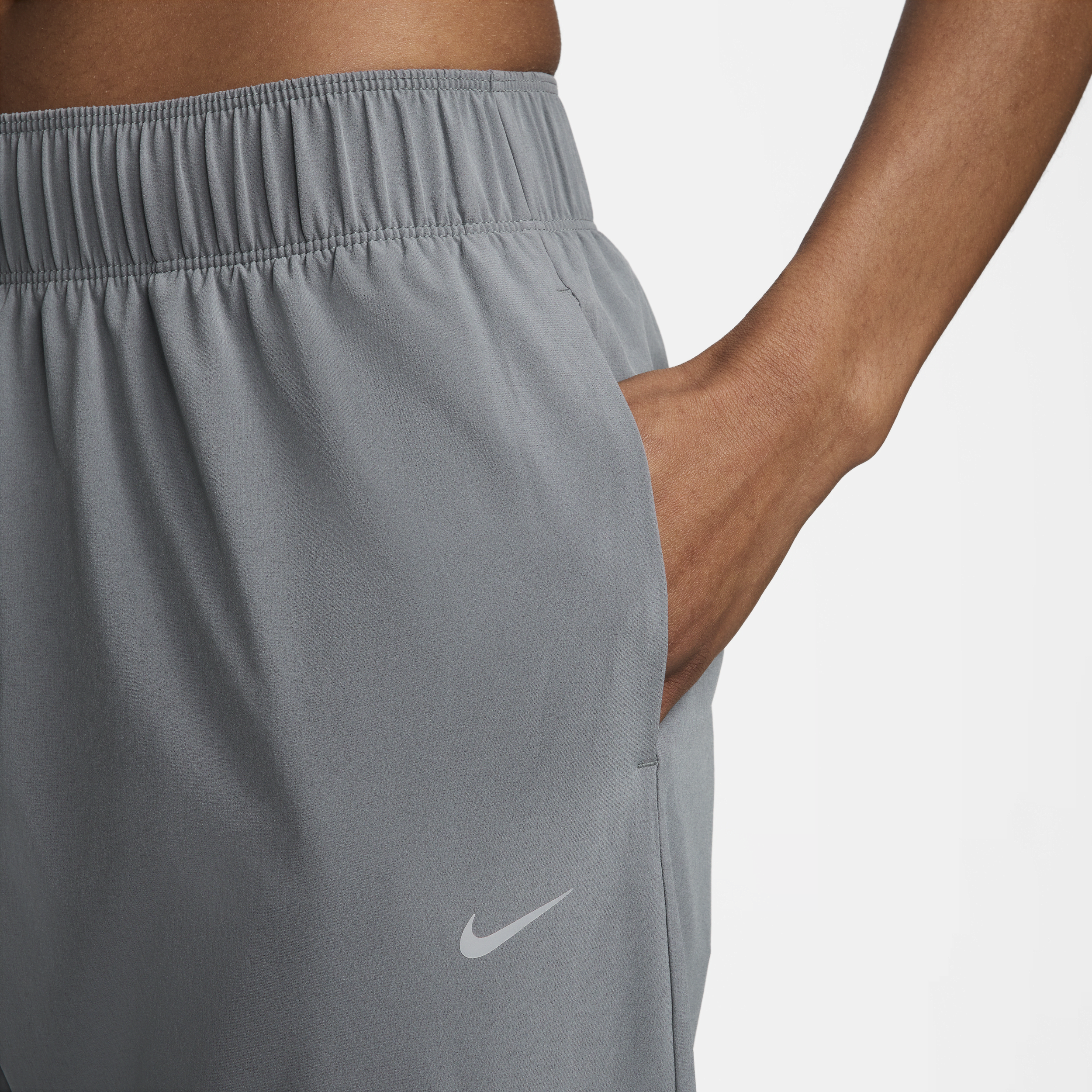 Nike Dri-FIT Fast 7 8-hardloopbroek met halfhoge taille voor dames Grijs