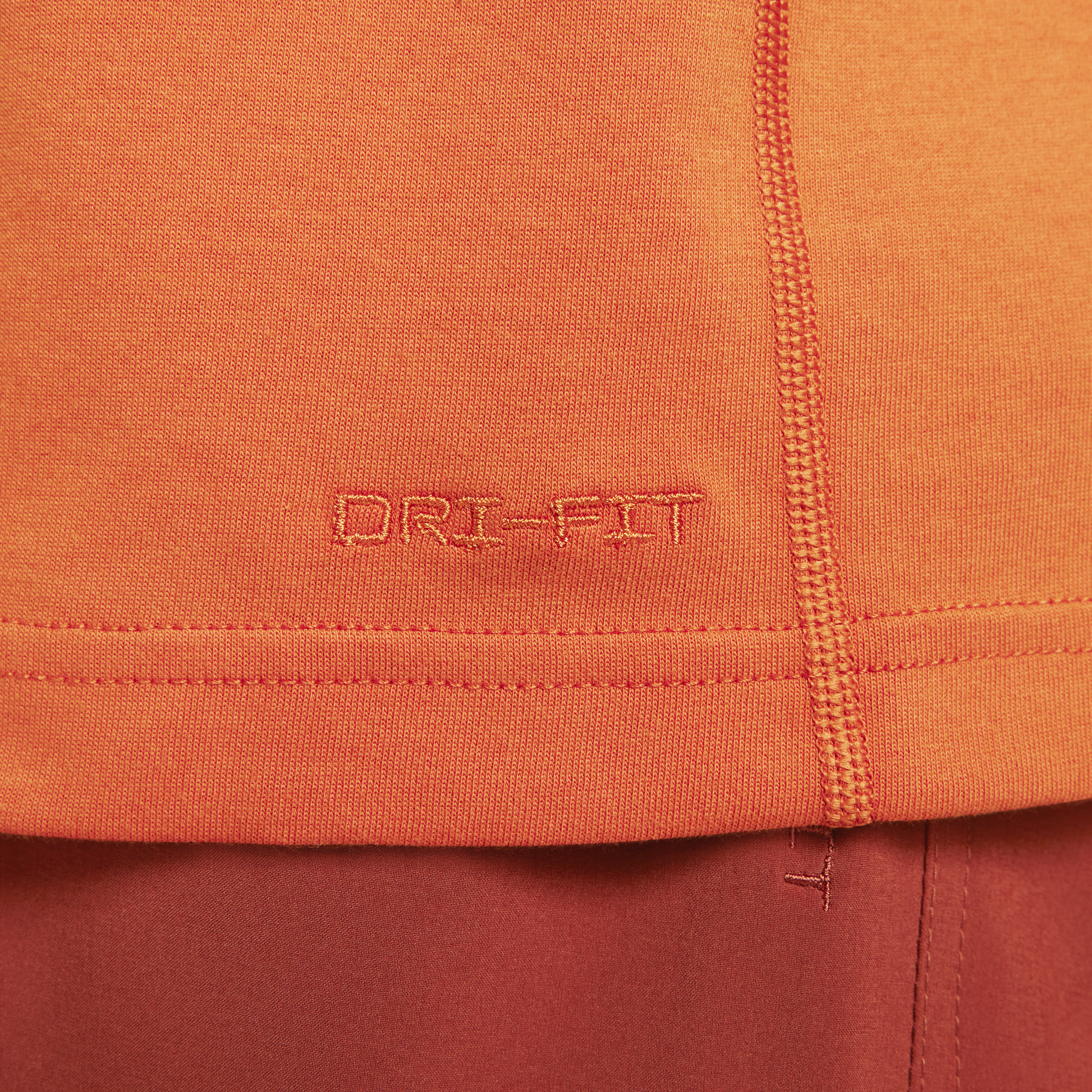 Nike Primary Dri-FIT multifunctionele herentop met korte mouwen Oranje
