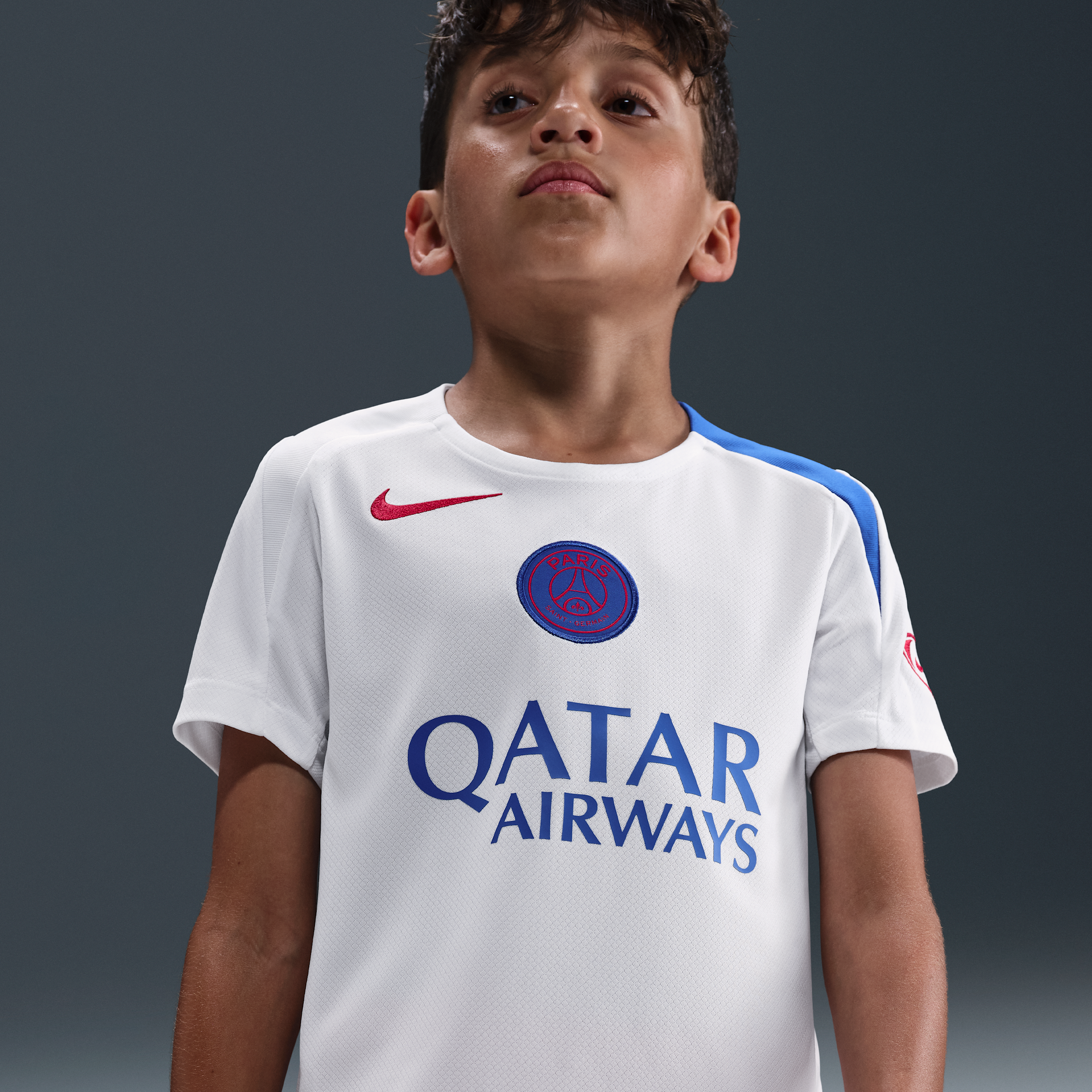 Maskinstrikket PSG Strike Third Nike Dri-FIT Total 90-fodboldtrøje til større børn - hvid