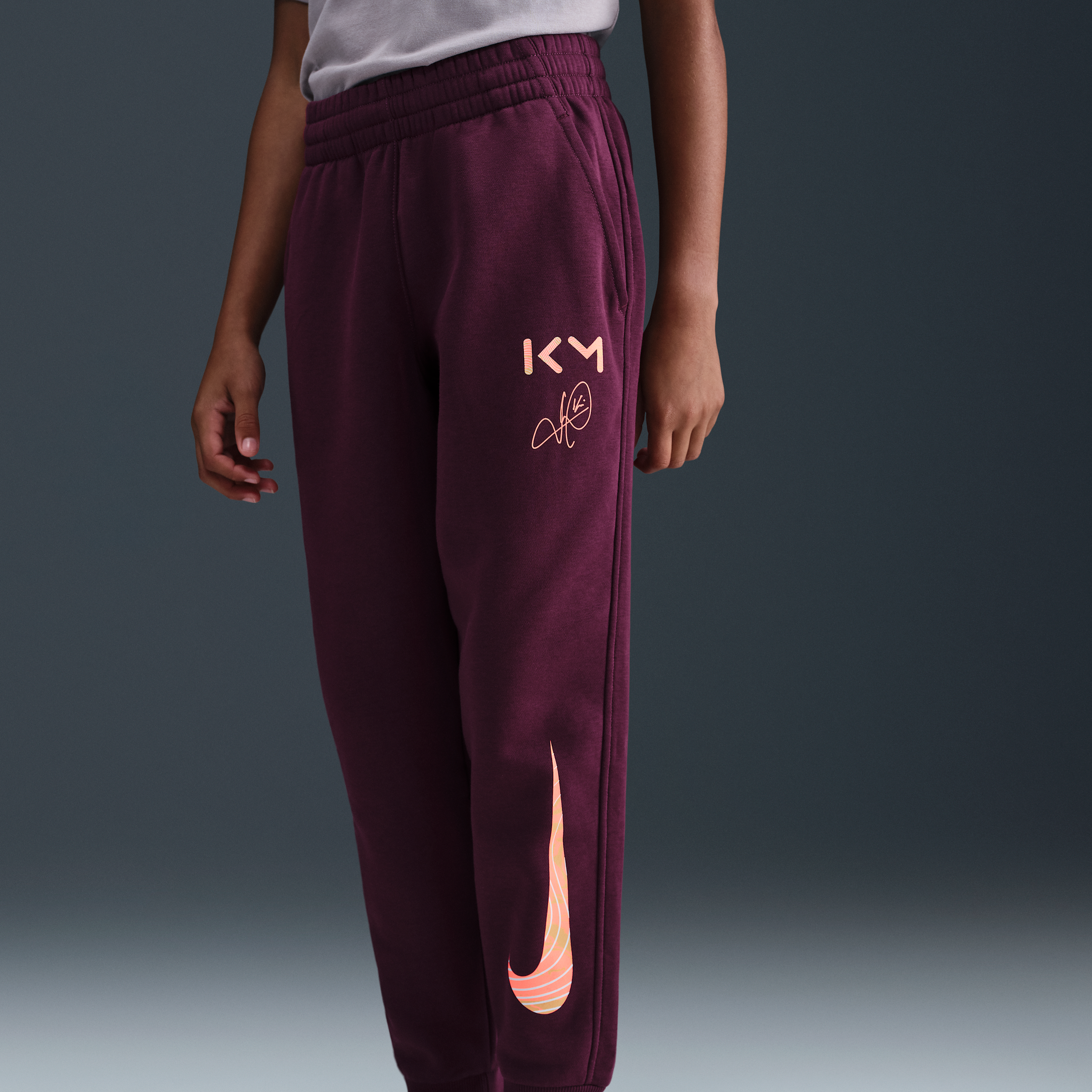 Thumbnail - Kylian Mbappé Club Fleece Fußball-Jogger (ältere Kinder) - Rot