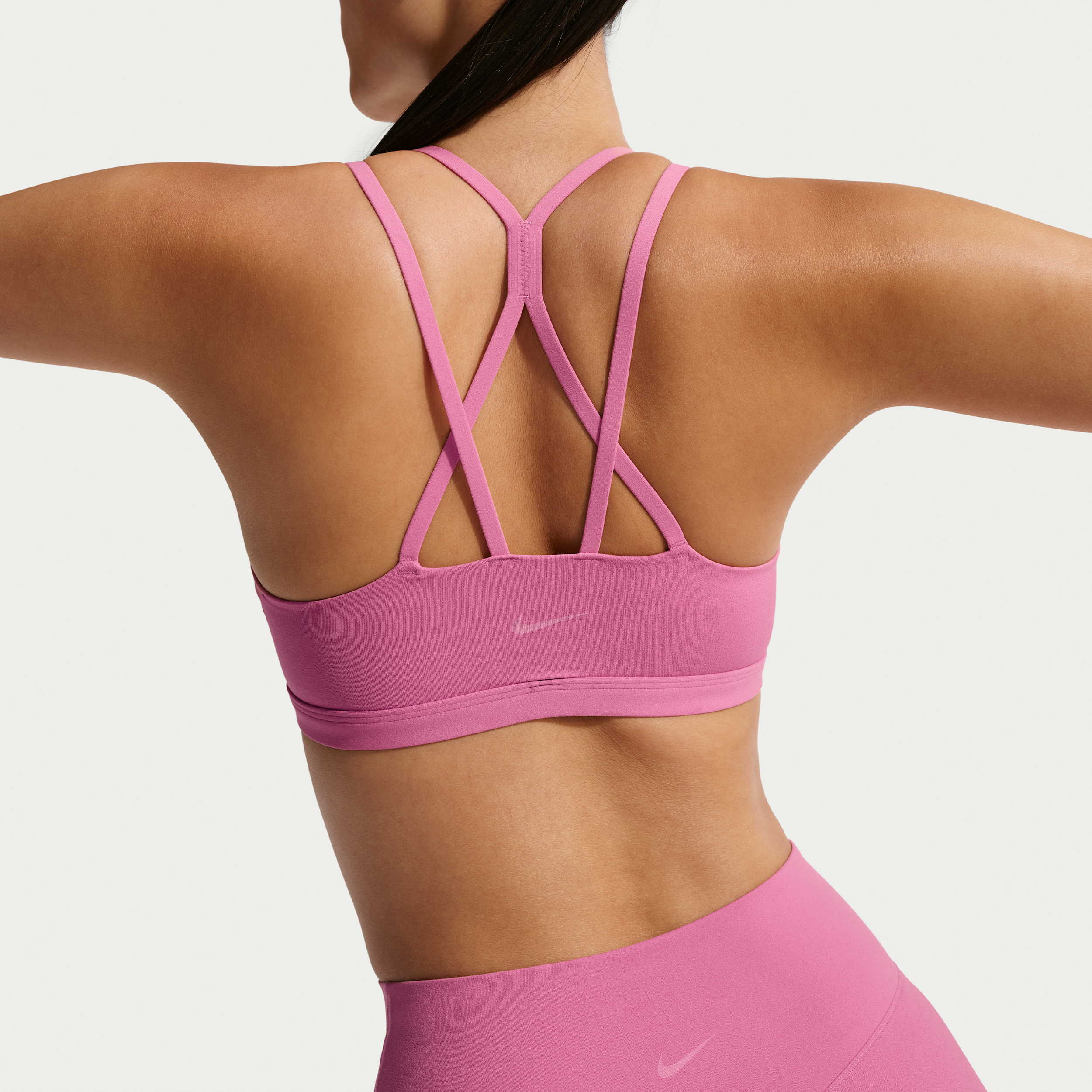 Nike Zenvy Strappy-sports-bh med let støtte og indlæg til kvinder - Pink