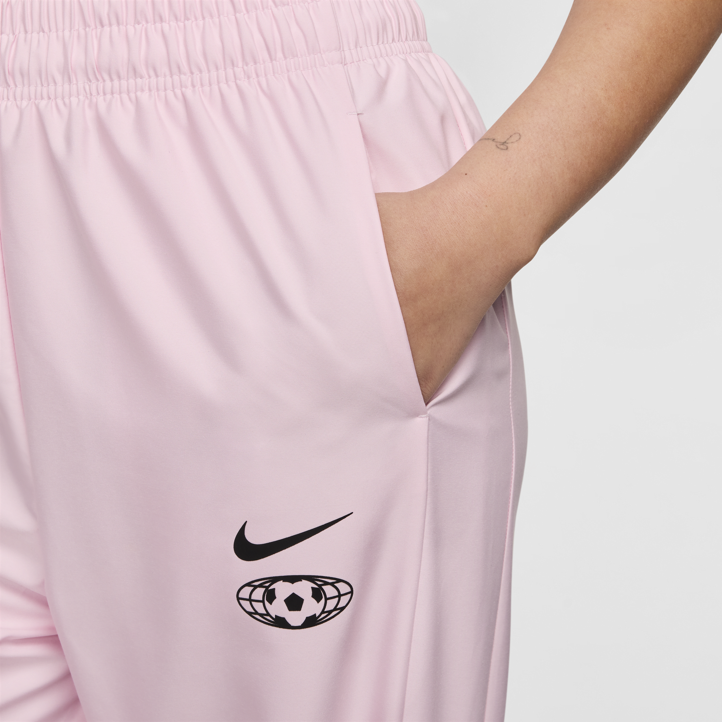 Nike Sportswear geweven joggingbroek voor dames Roze