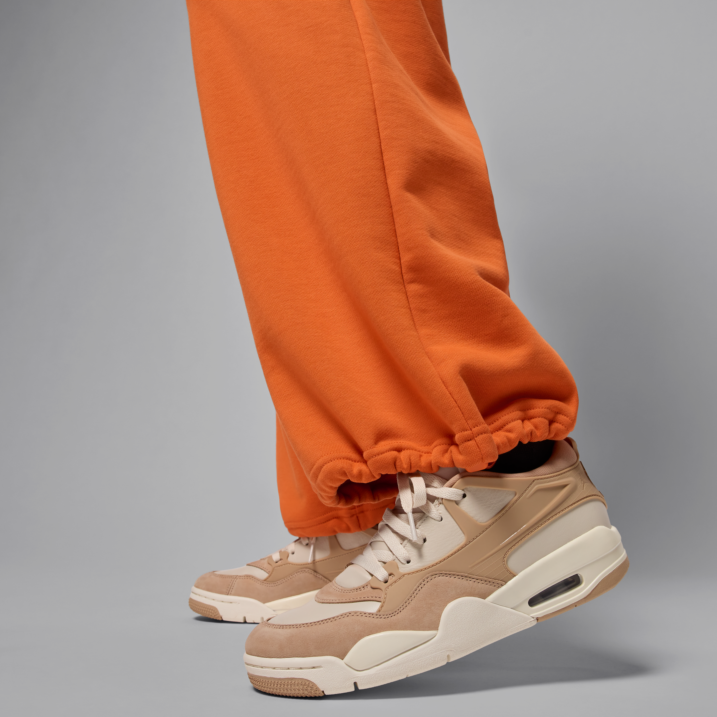 Jordan Flight Fleece damesbroek van sweatstof met open zoom Oranje