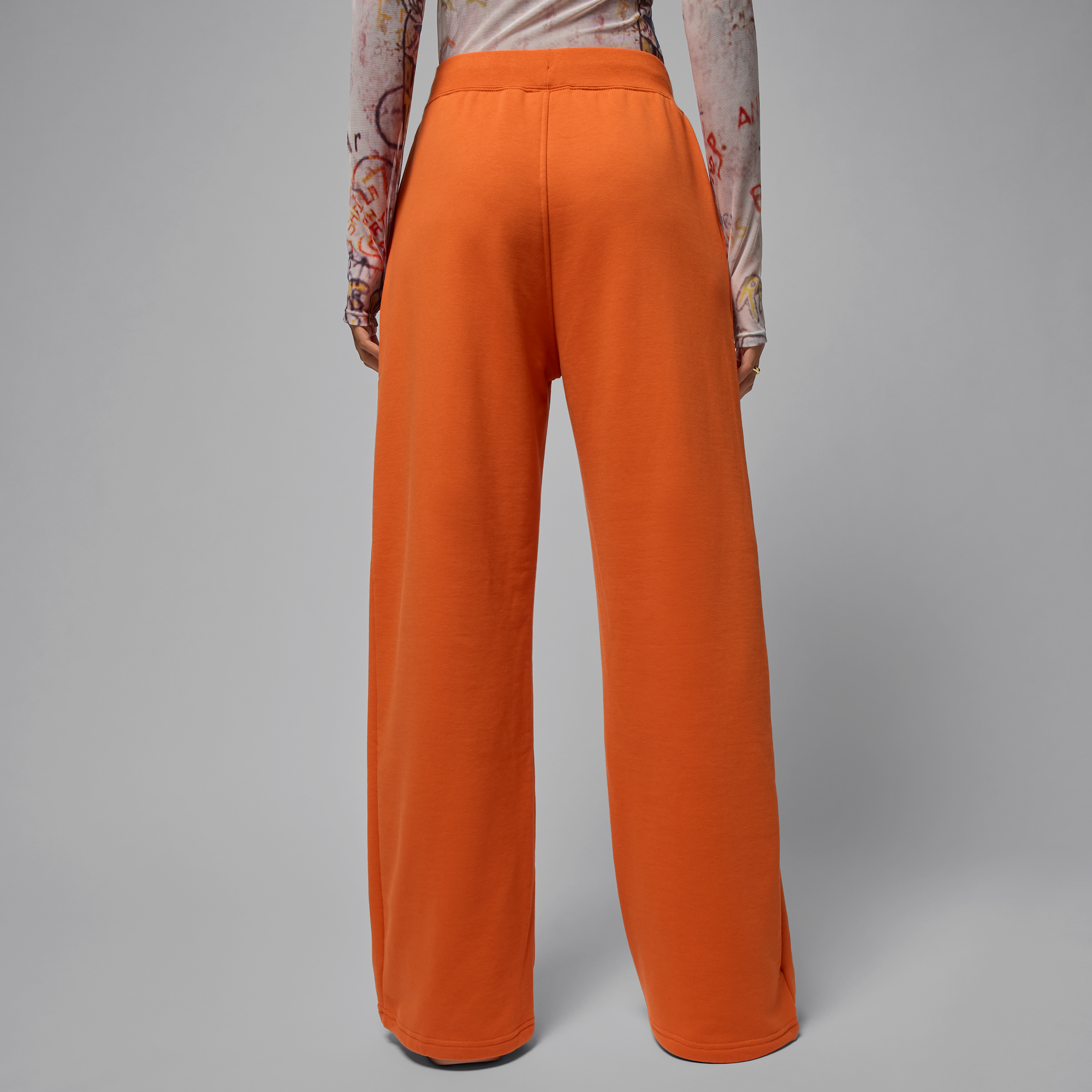 Jordan Flight Fleece damesbroek van sweatstof met open zoom Oranje