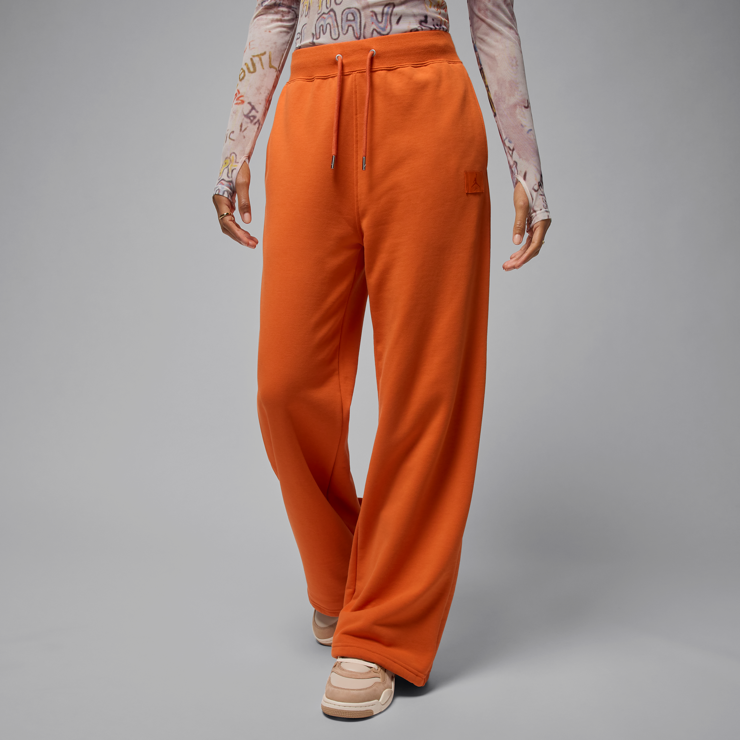 Jordan Flight Fleece damesbroek van sweatstof met open zoom Oranje