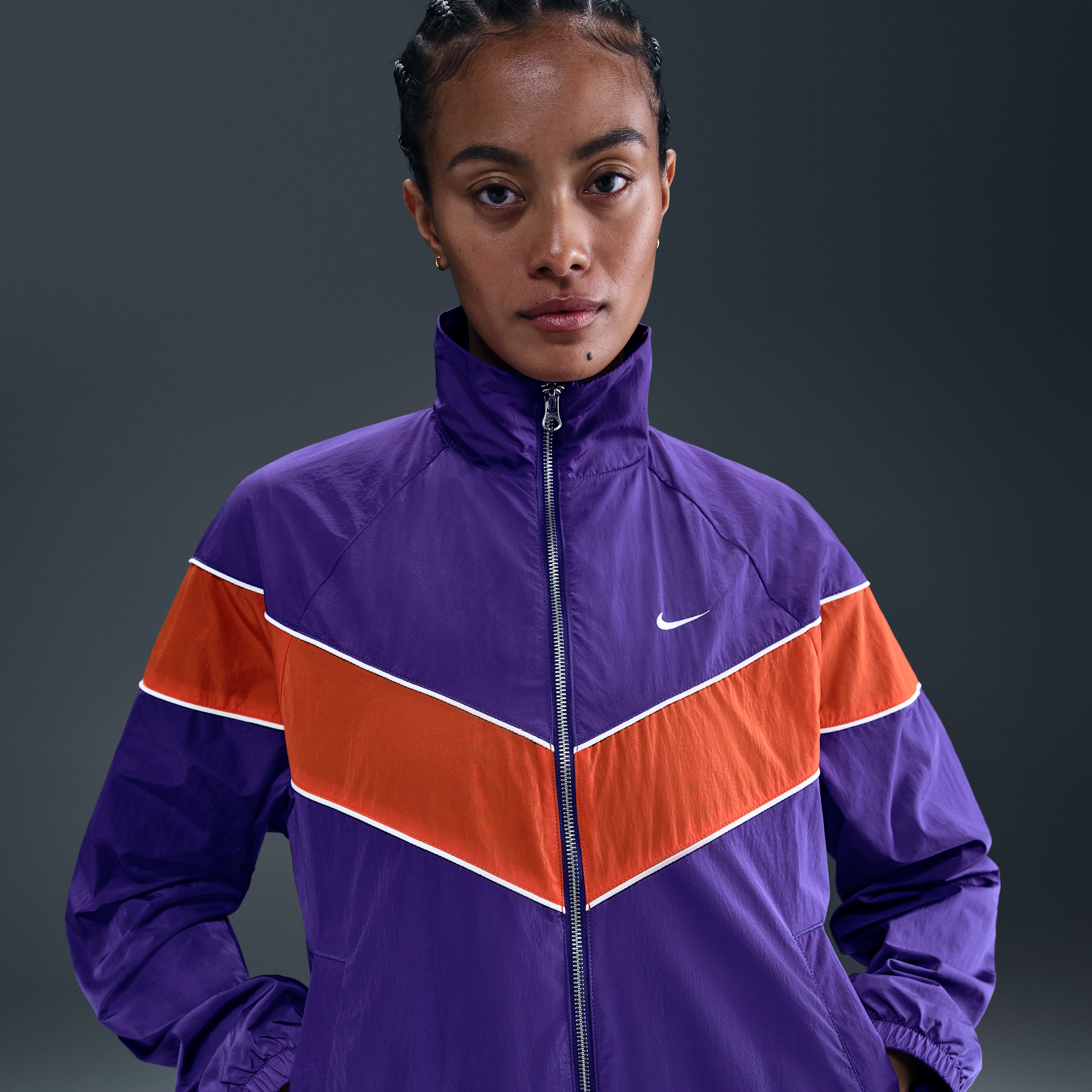 Nike Windrunner ruimvallend geweven damesjack met uv-bescherming en rits over de hele lengte - Paars