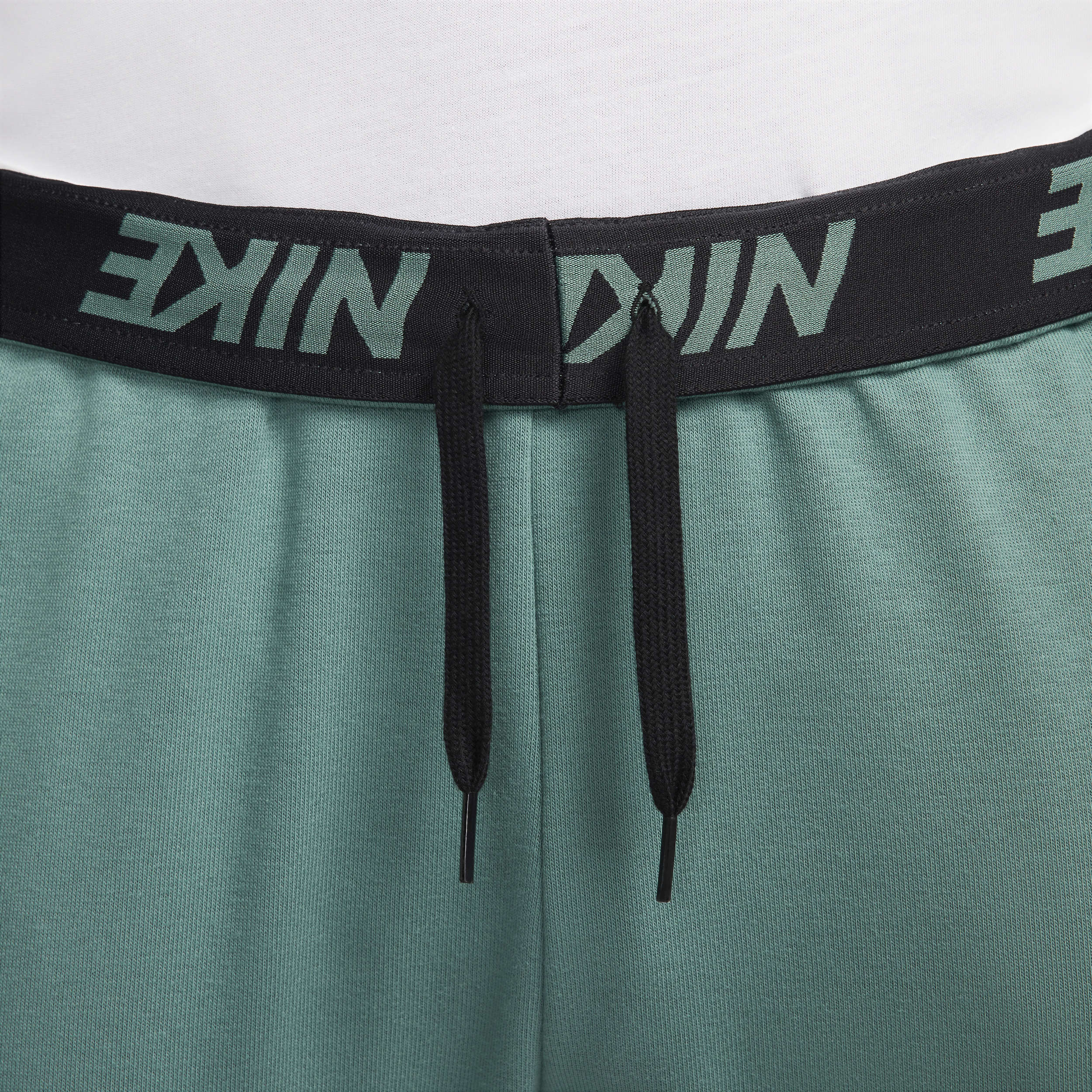 Nike Dry Graphic Dri-FIT toelopende fitnessbroek voor heren Groen