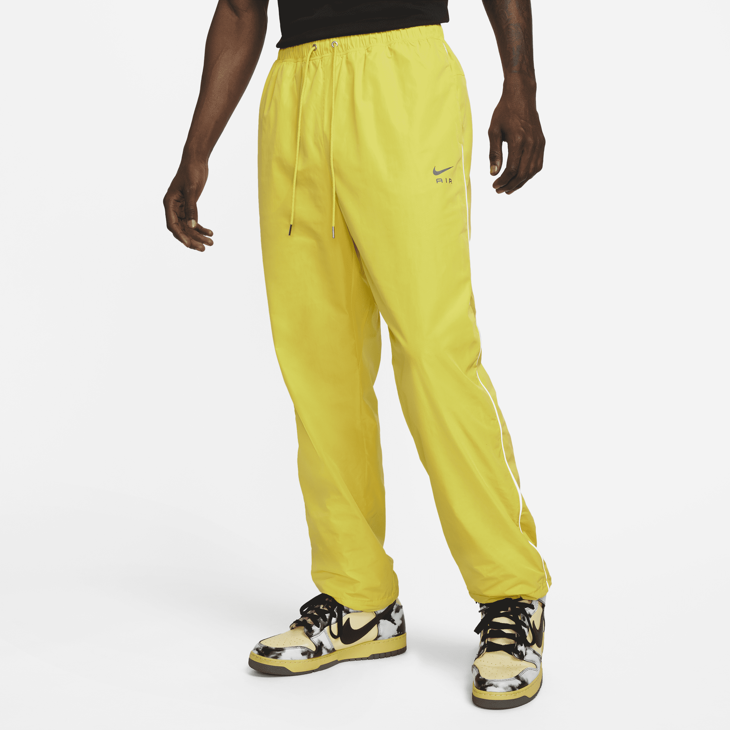 Męskie spodnie z tkaniny Nike Sportswear Air - Żółty