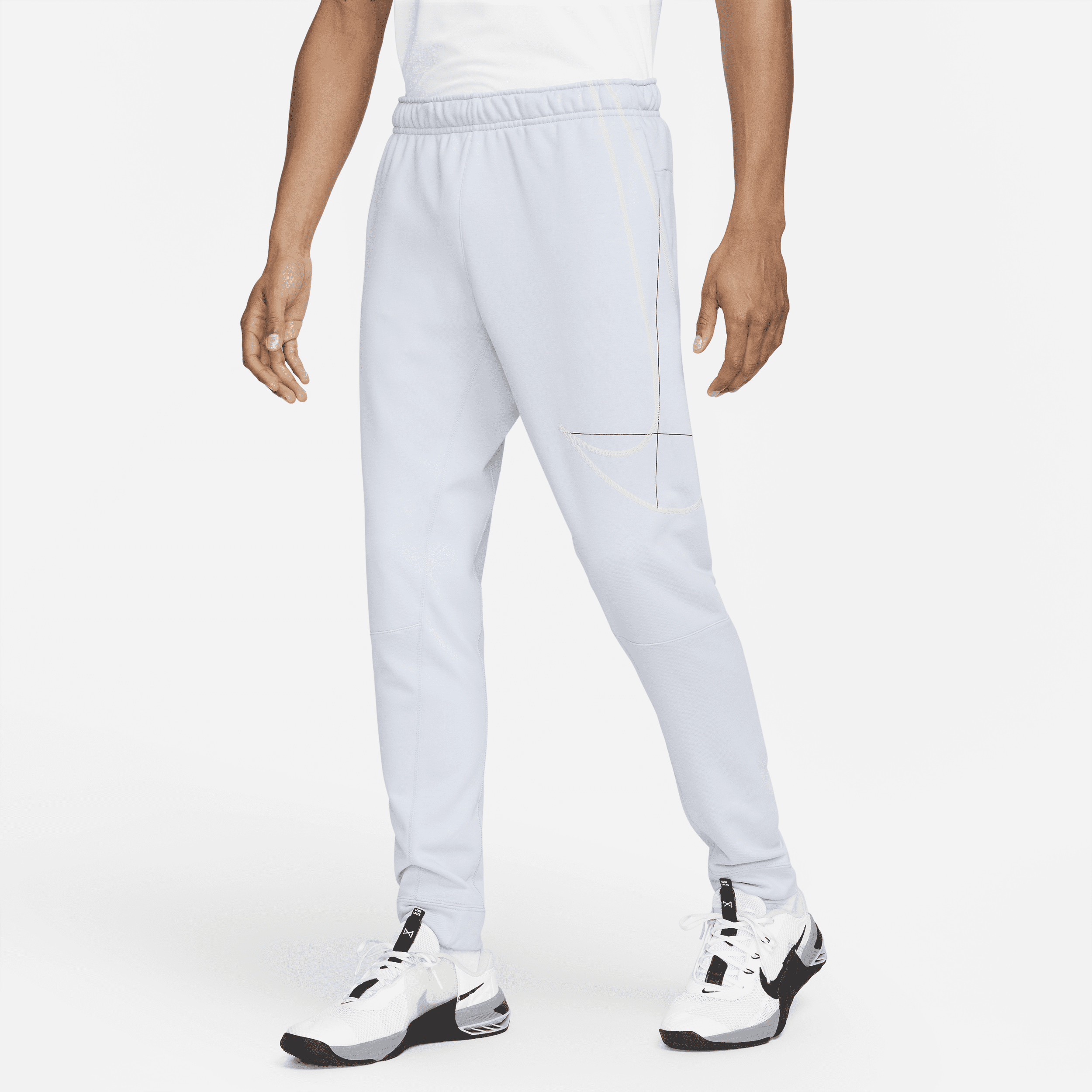 Męskie spodnie do biegania o zwężanym kroju z dzianiny Nike Dri-FIT - Niebieski
