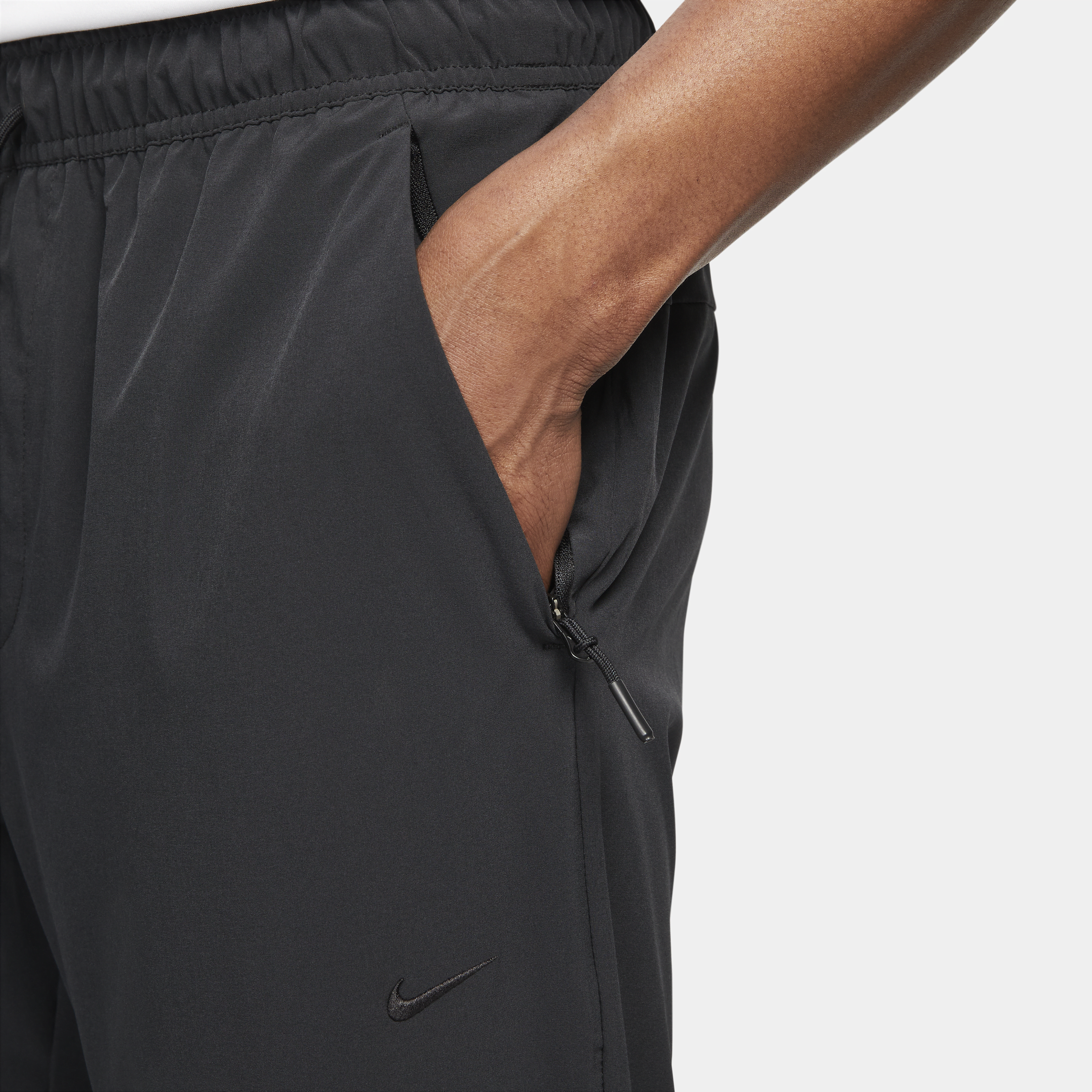 Pantalon avec ouvertures à zip Nike Dri-FIT Unlimited pour homme - Noir