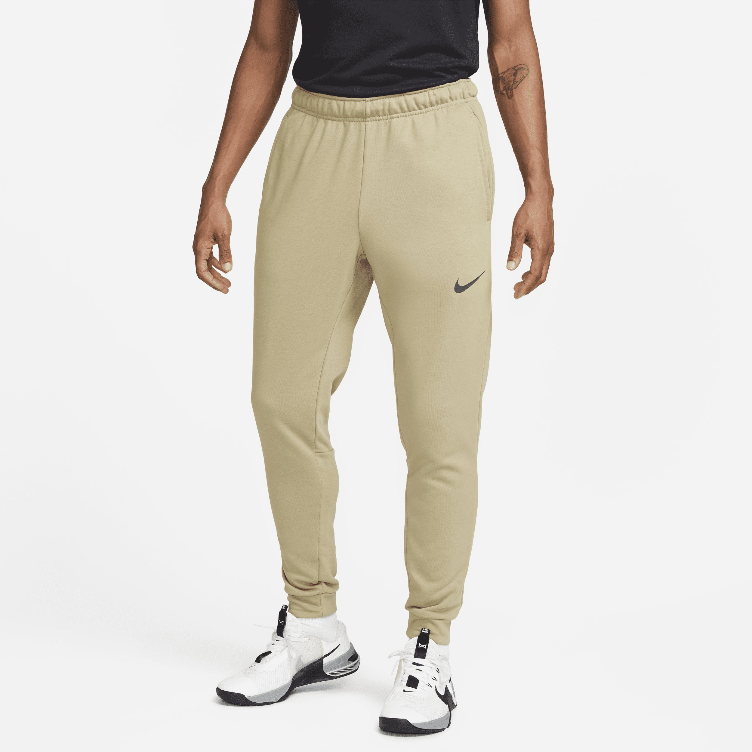 Image of Nike Dry Dri-FIT toelopende fitnessbroek van fleece voor heren - Bruin