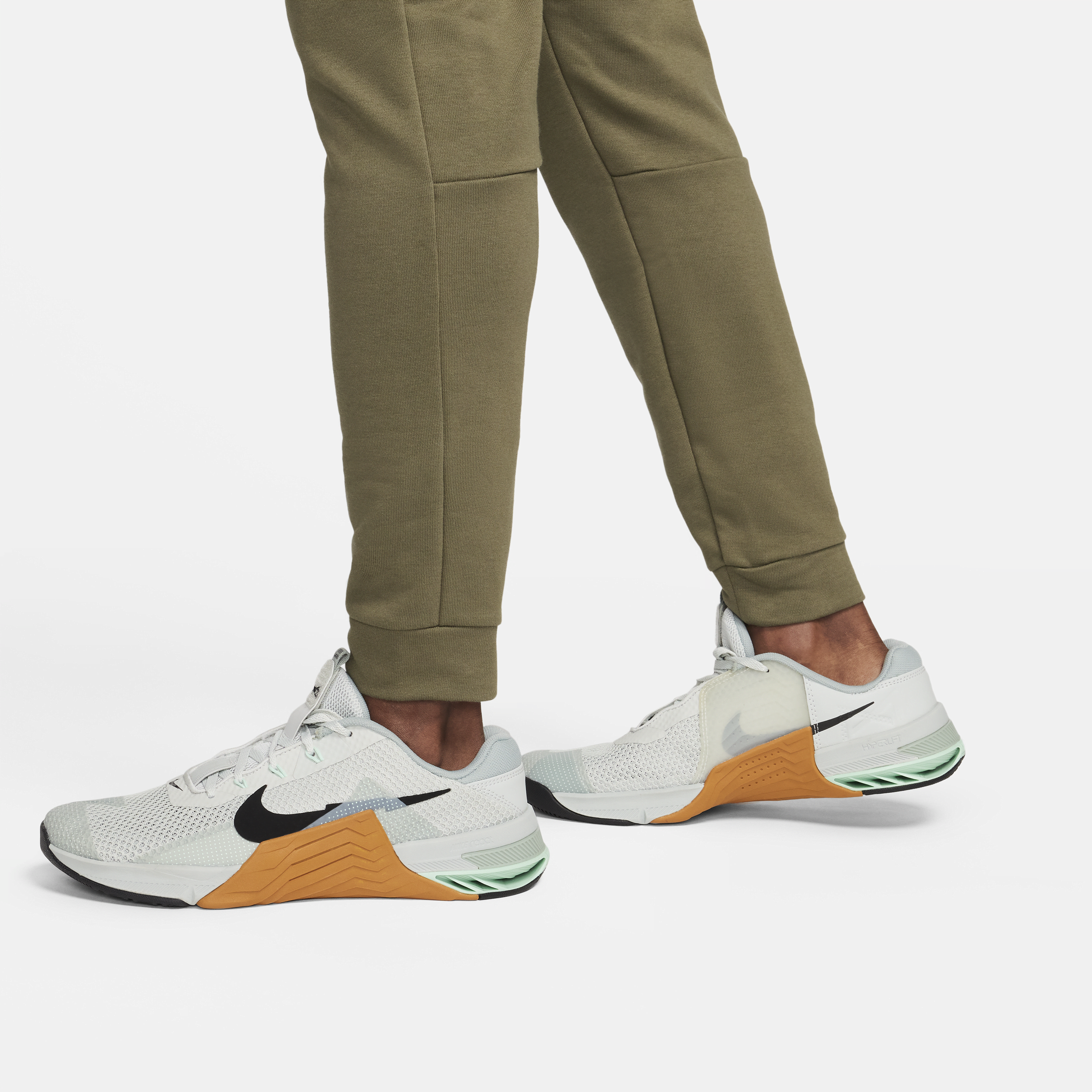 Nike Dry Dri-FIT toelopende fitnessbroek van fleece voor heren Groen
