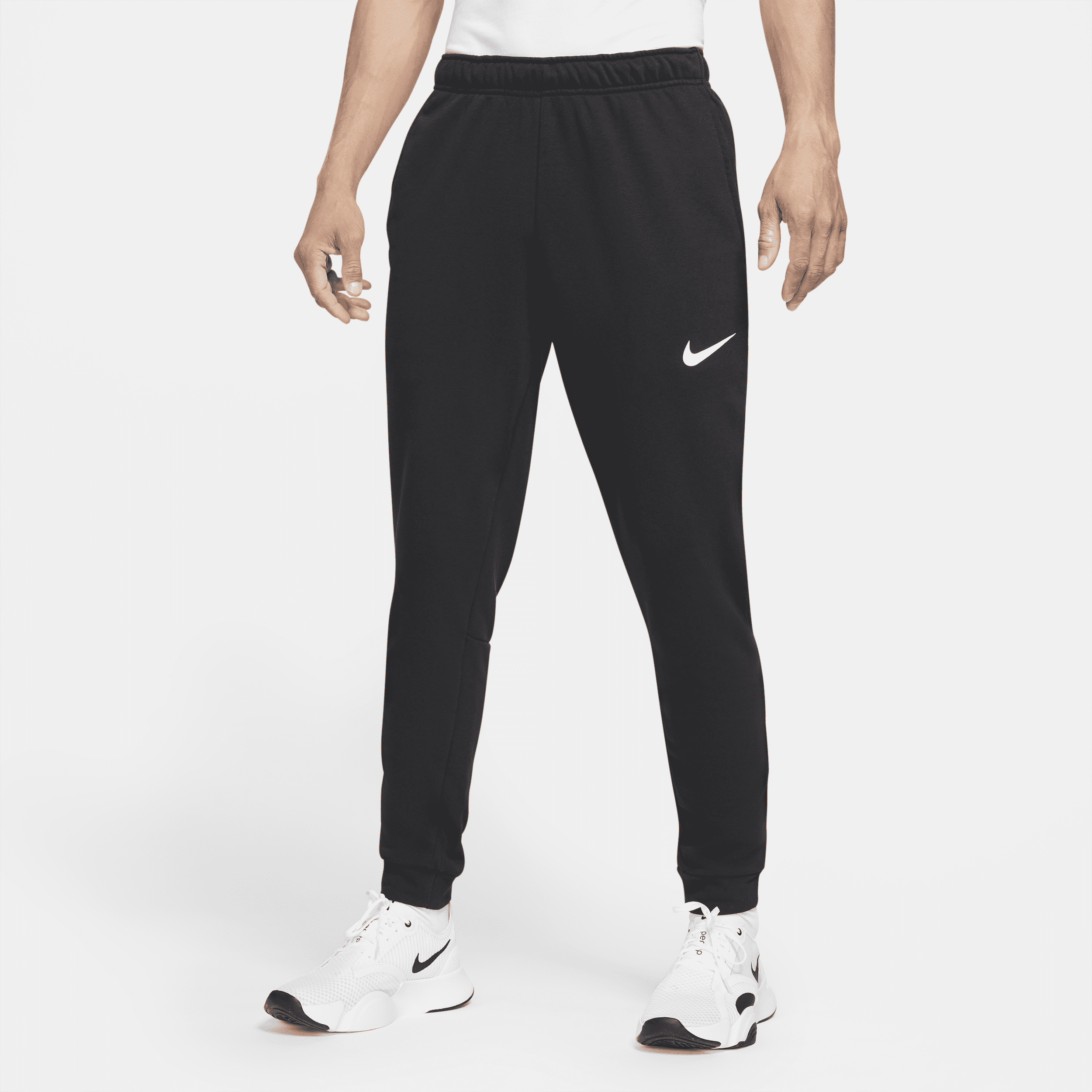 Image of Nike Dry Dri-FIT toelopende fitnessbroek van fleece voor heren - Zwart