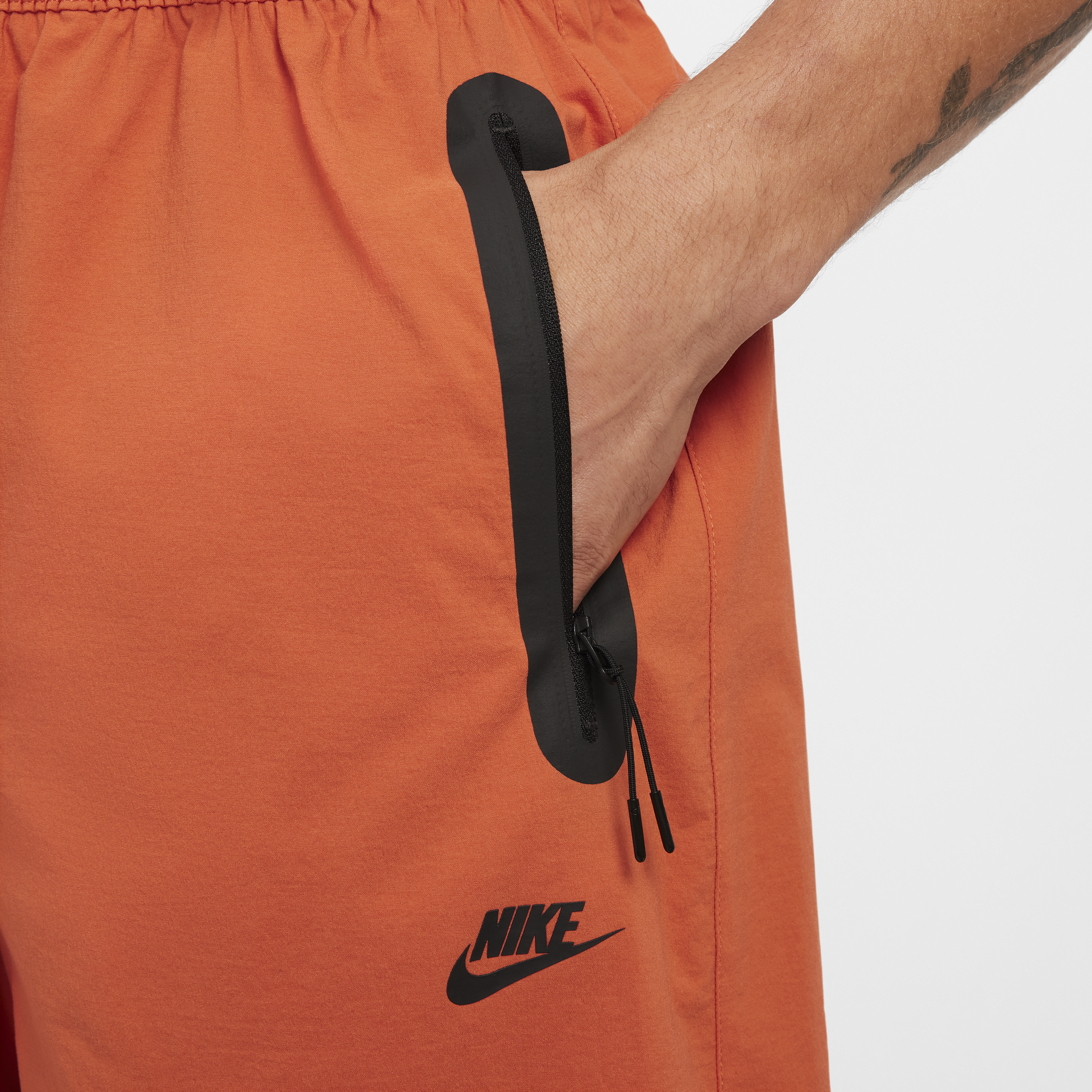 Pantalon oversize tissé Nike Tech pour homme - Orange