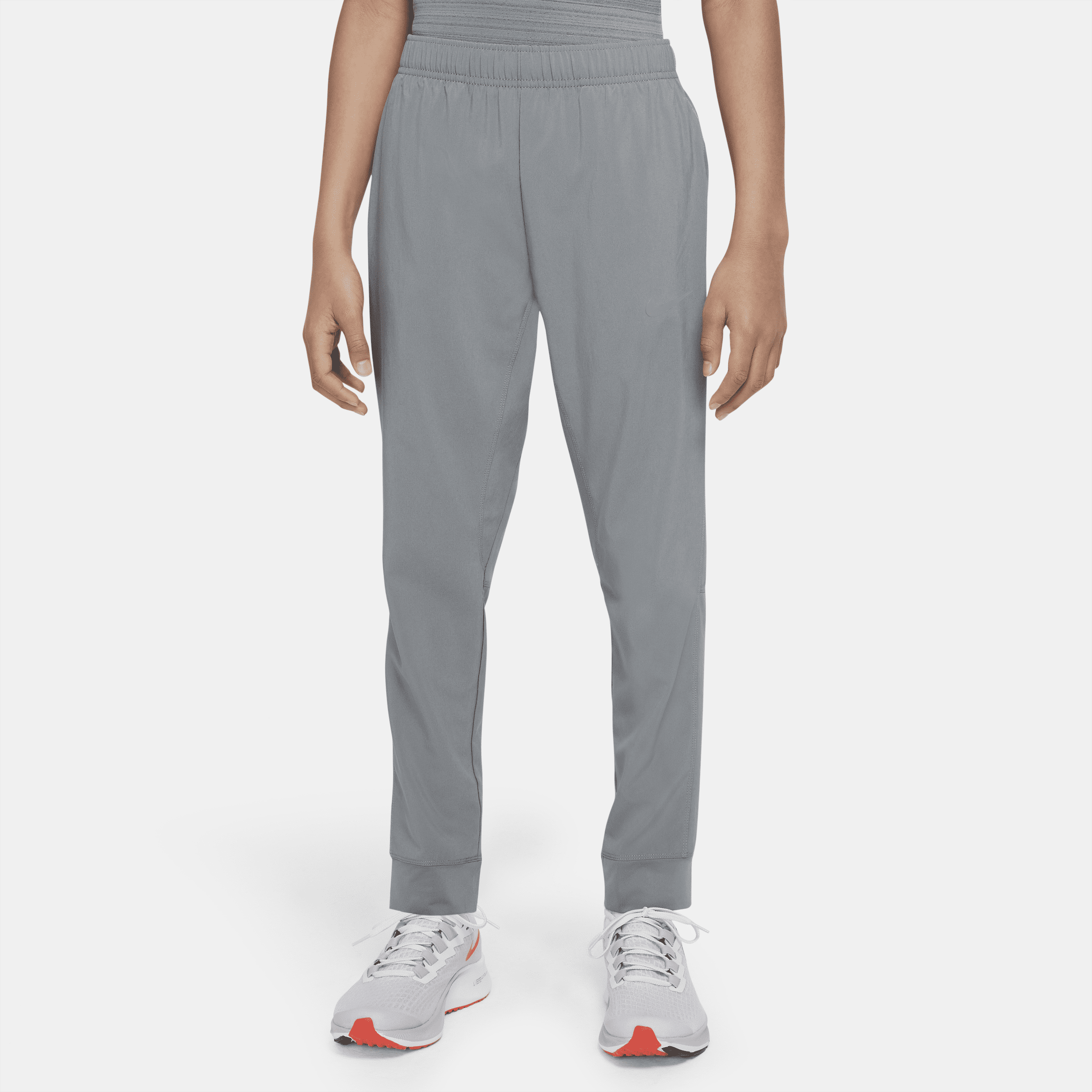 Nike Dri-FIT-træningsbukser i vævet materiale til større børn (drenge) - grå