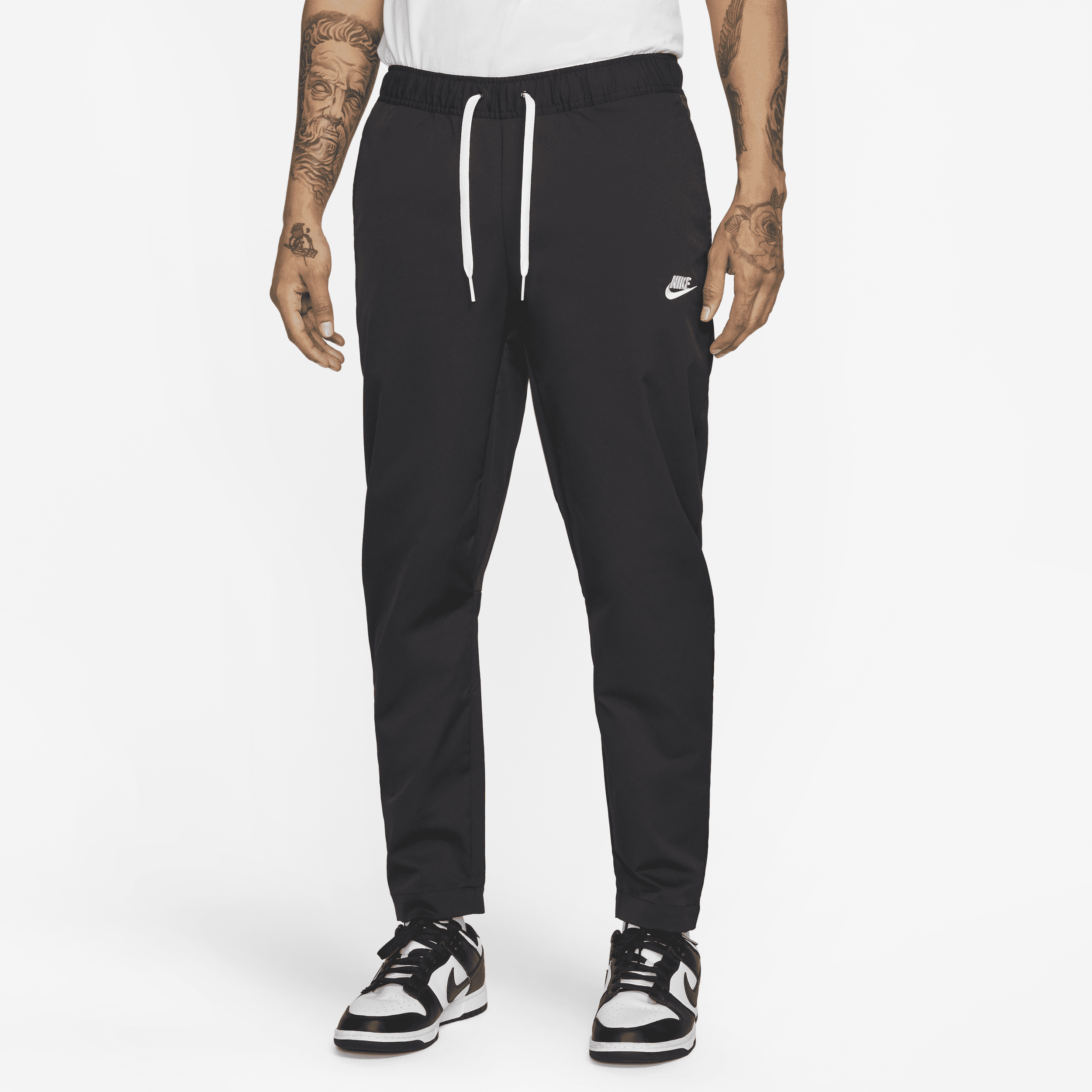 Vævede Nike Club-bukser med faconsyede ben til mænd - sort