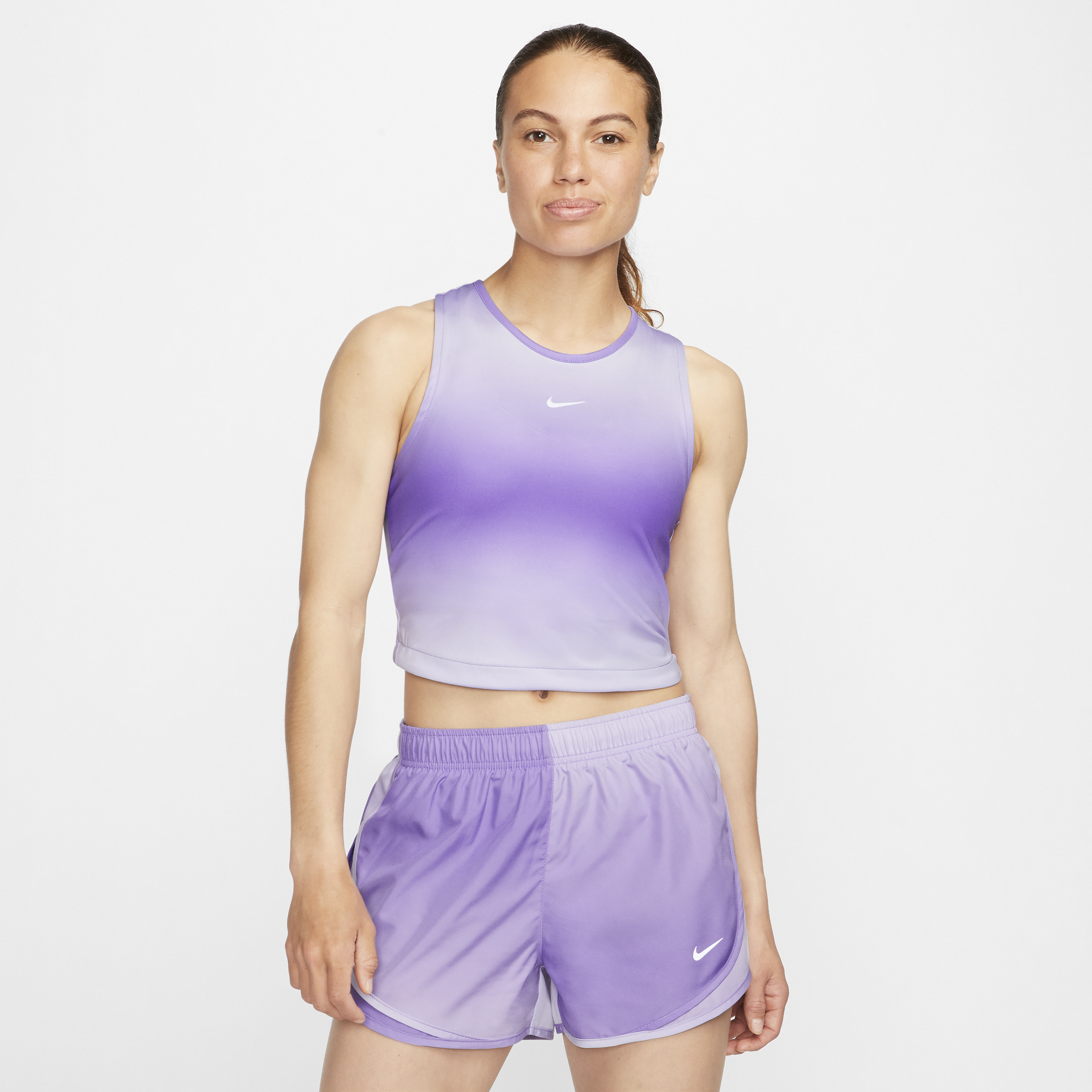 Kort Nike Dri-FIT Swoosh-løbetanktop til kvinder - lilla