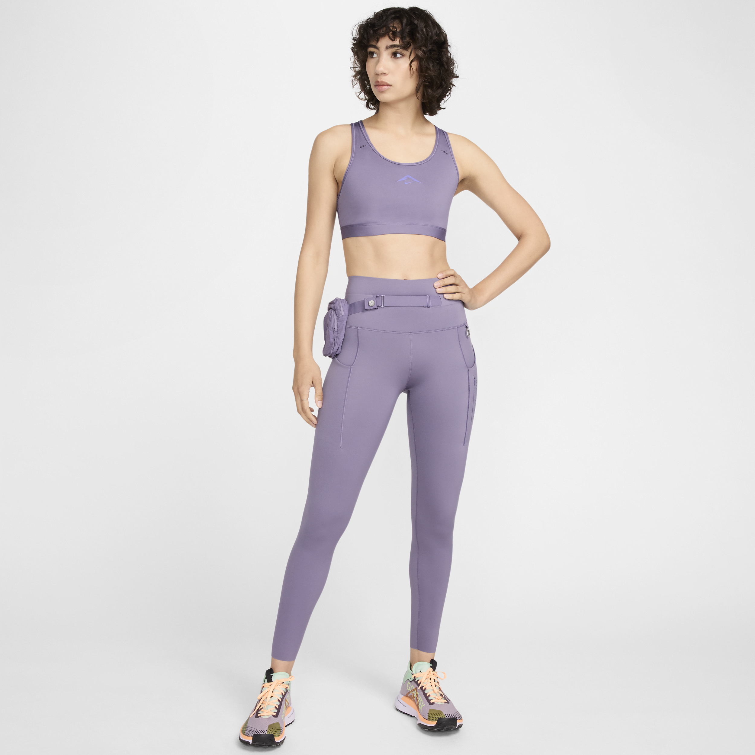 Nike Trail Go-leggings i 7/8 længde med høj talje, fast støtte og lommer til kvinder - lilla