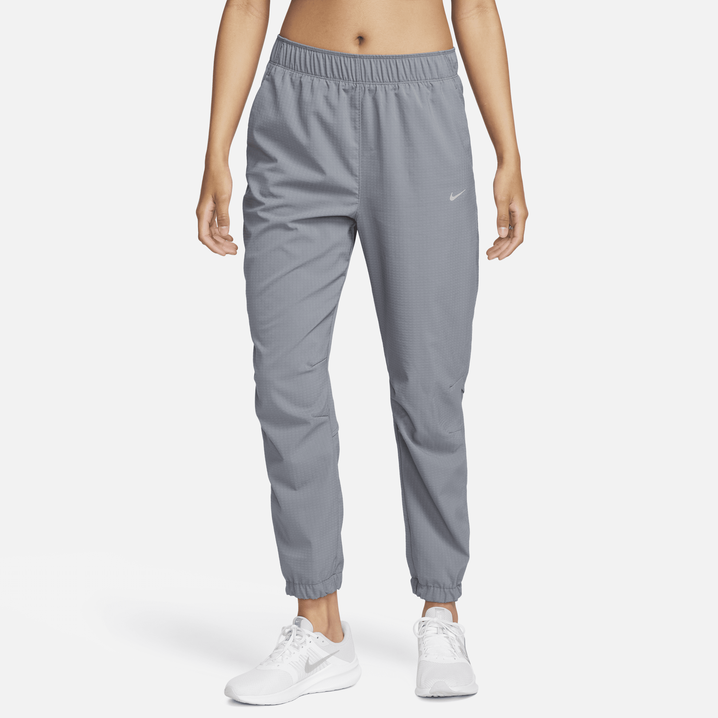 Nike Dri-FIT Fast-opvarmningsbukser i 7/8 længde med mellemhøj talje til kvinder - grå