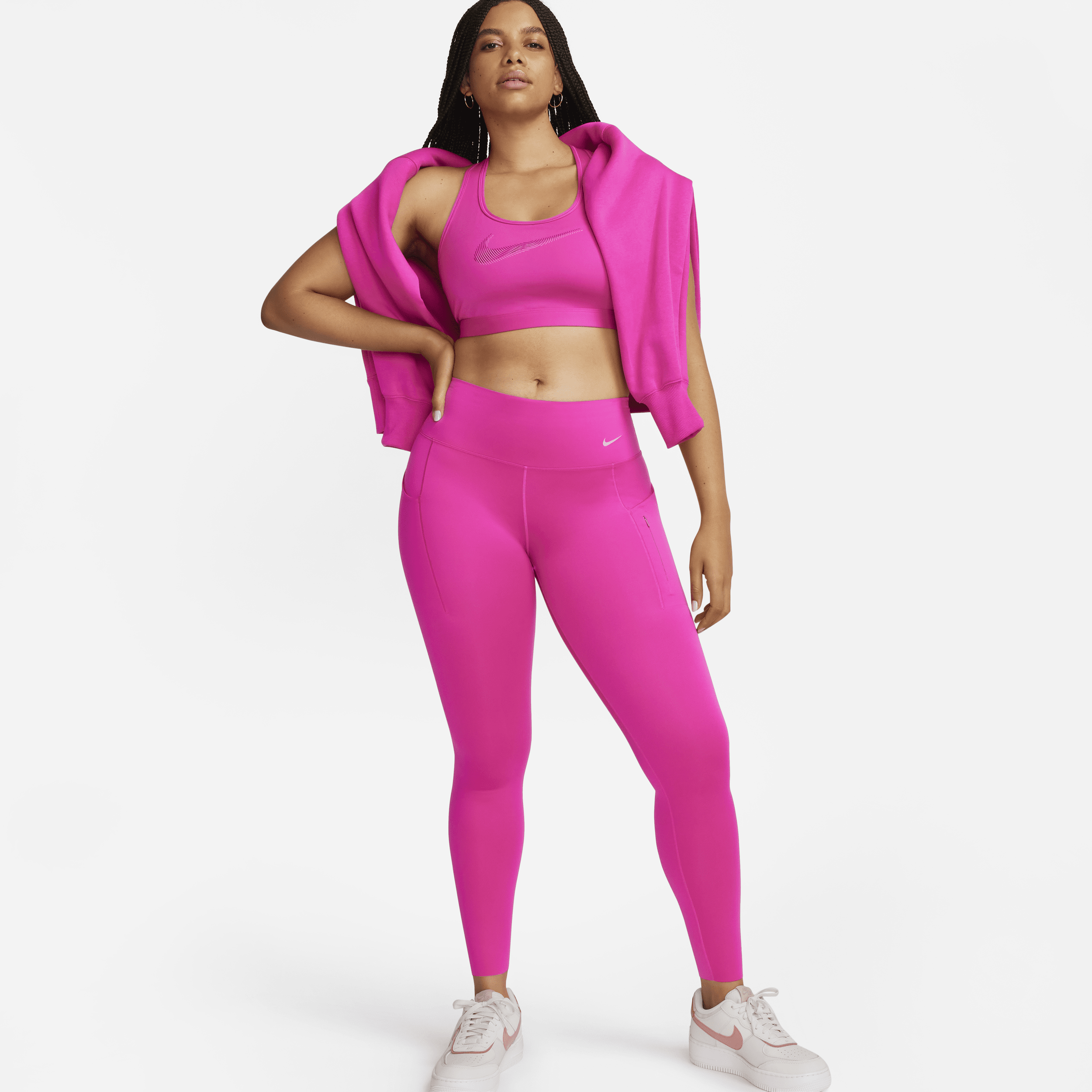 Lange Nike Go-leggings med højt støtteniveau, mellemhøj talje og lommer til kvinder - Pink