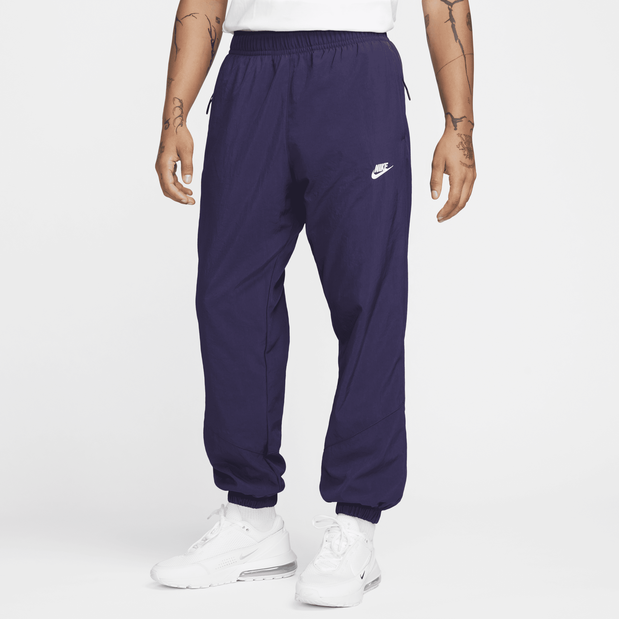 Pantaloni in tessuto per l'inverno Nike Windrunner – Uomo - Viola