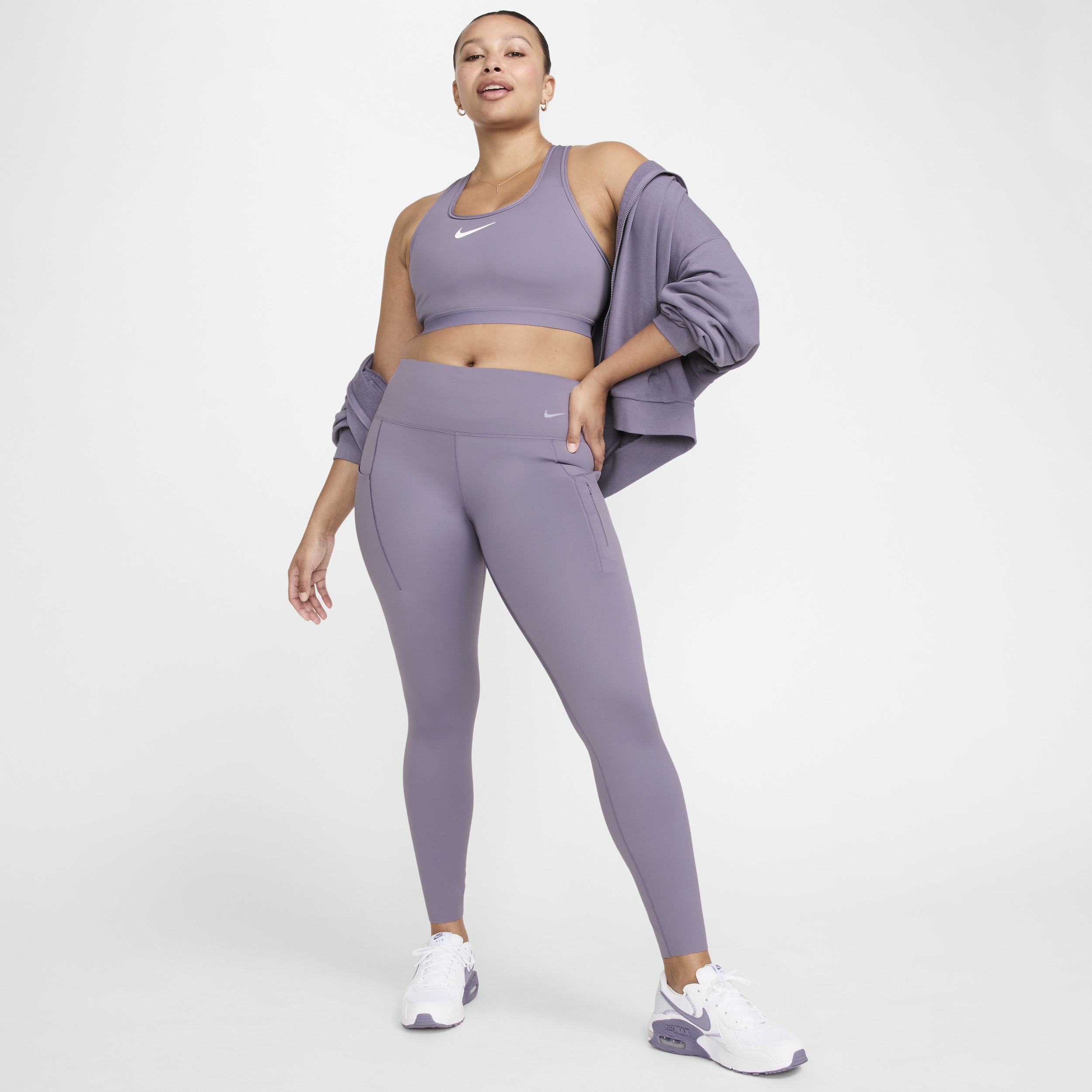 Lange Nike Go-leggings med højt støtteniveau, mellemhøj talje og lommer til kvinder - lilla