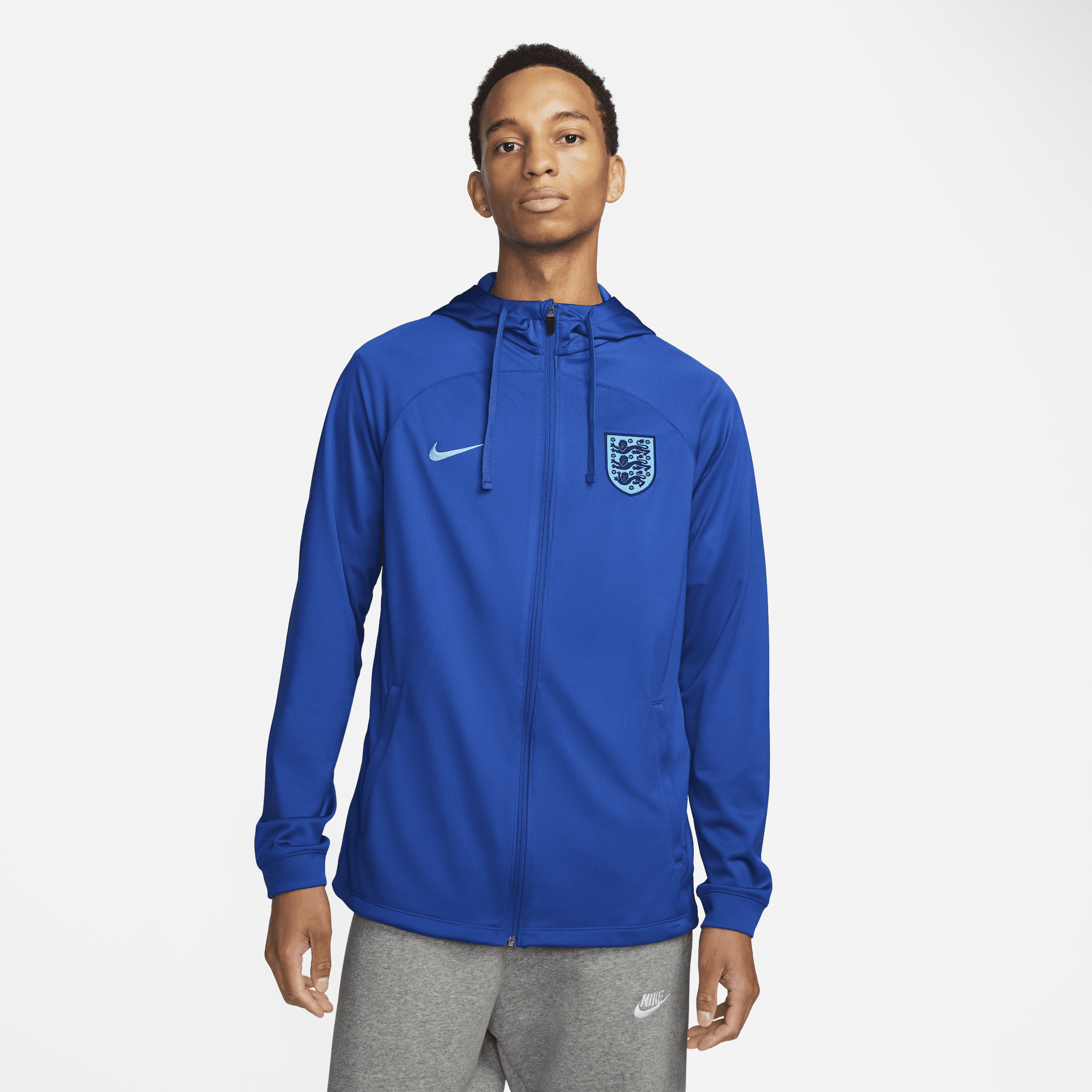 England Strike Nike Dri-FIT-fodboldtræningsjakke med hætte til mænd - blå