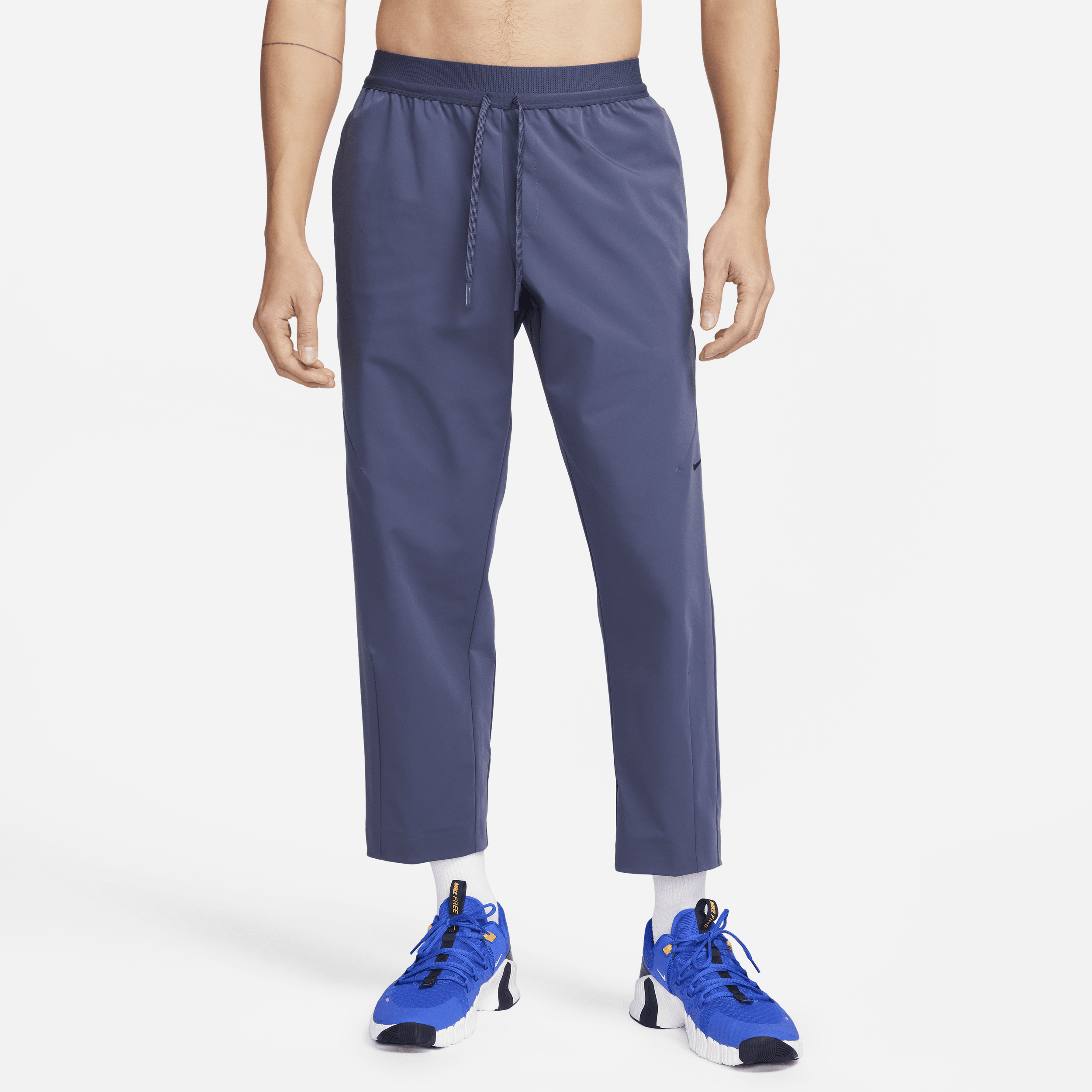 Nike A.P.S. Vævede, alsidige Dri-FIT-bukser til mænd - blå