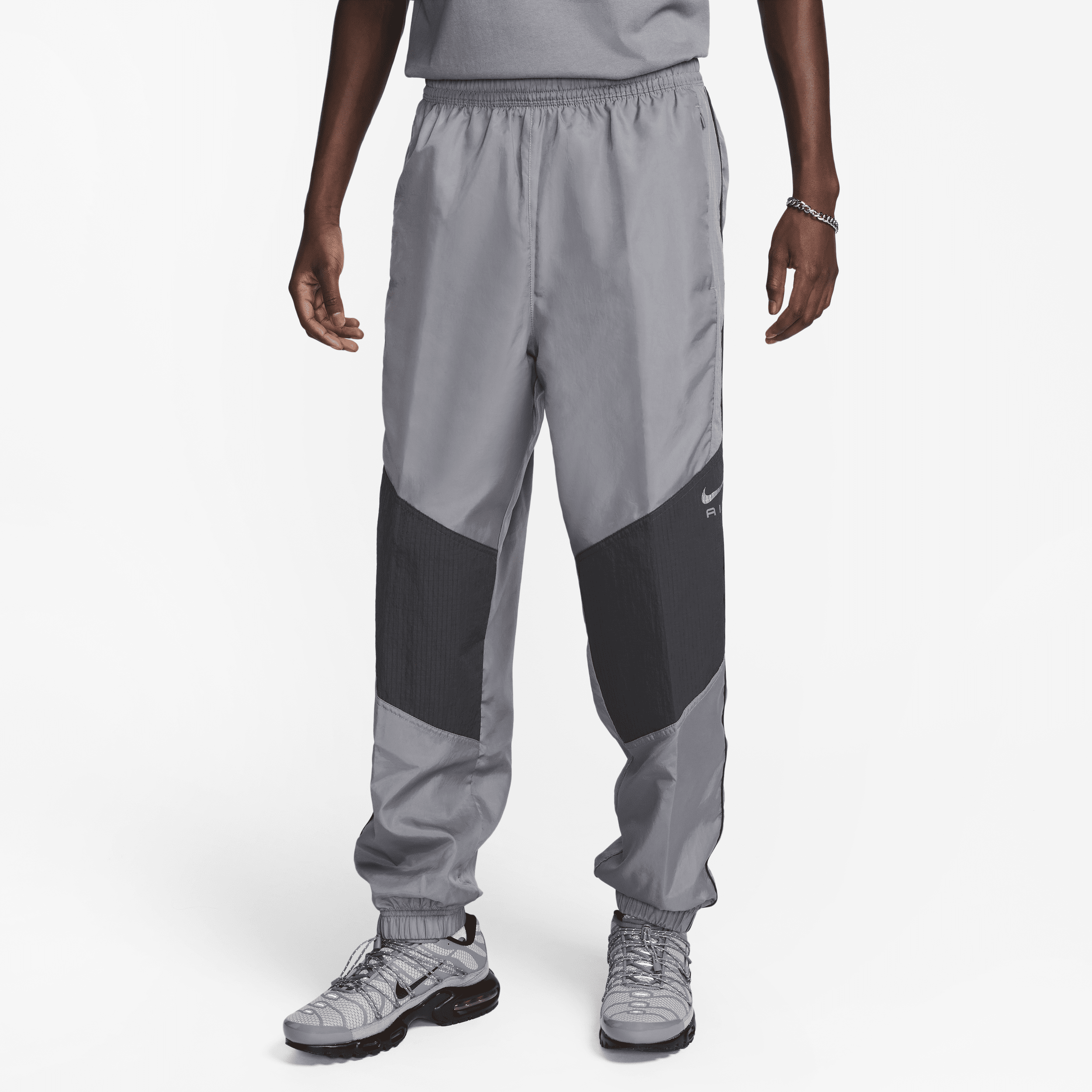 Pantaloni in tessuto Nike Air – Uomo - Grigio