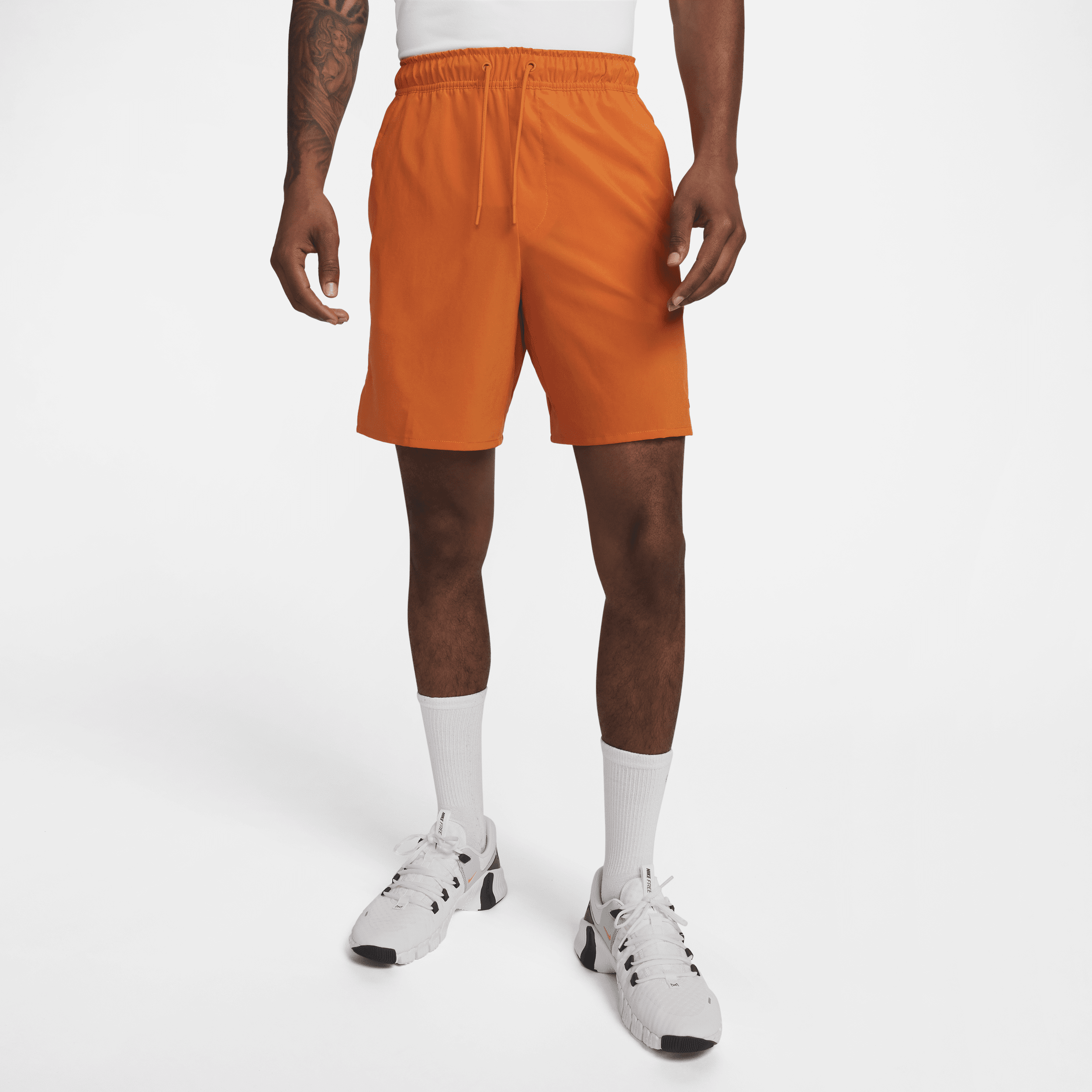 Nike Unlimited multifunctionele niet-gevoerde herenshorts met Dri-FIT (18 cm) - Oranje