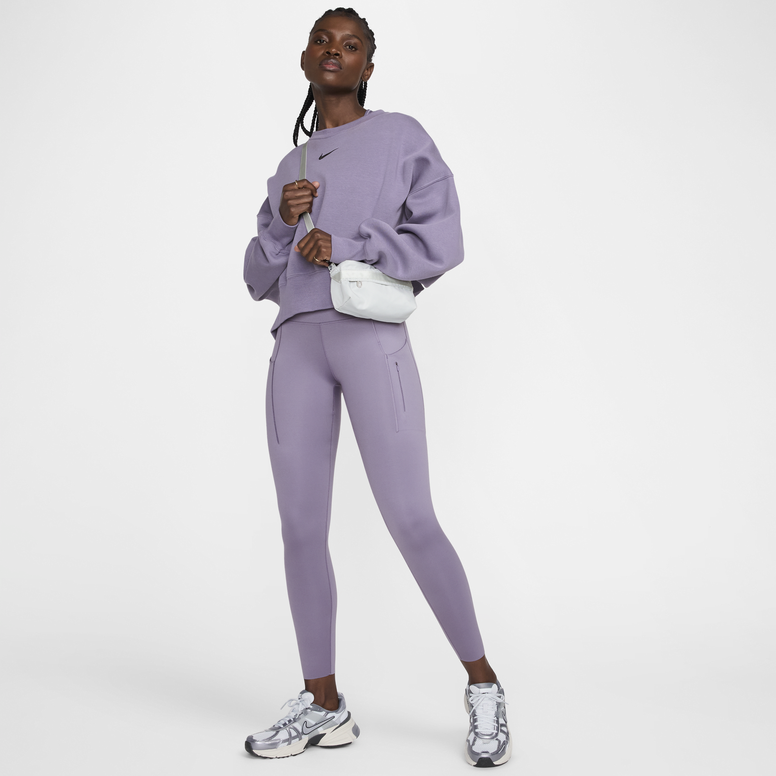 Nike Go-7/8-leggings med højt støtteniveau, mellemhøj talje og lommer til kvinder - lilla