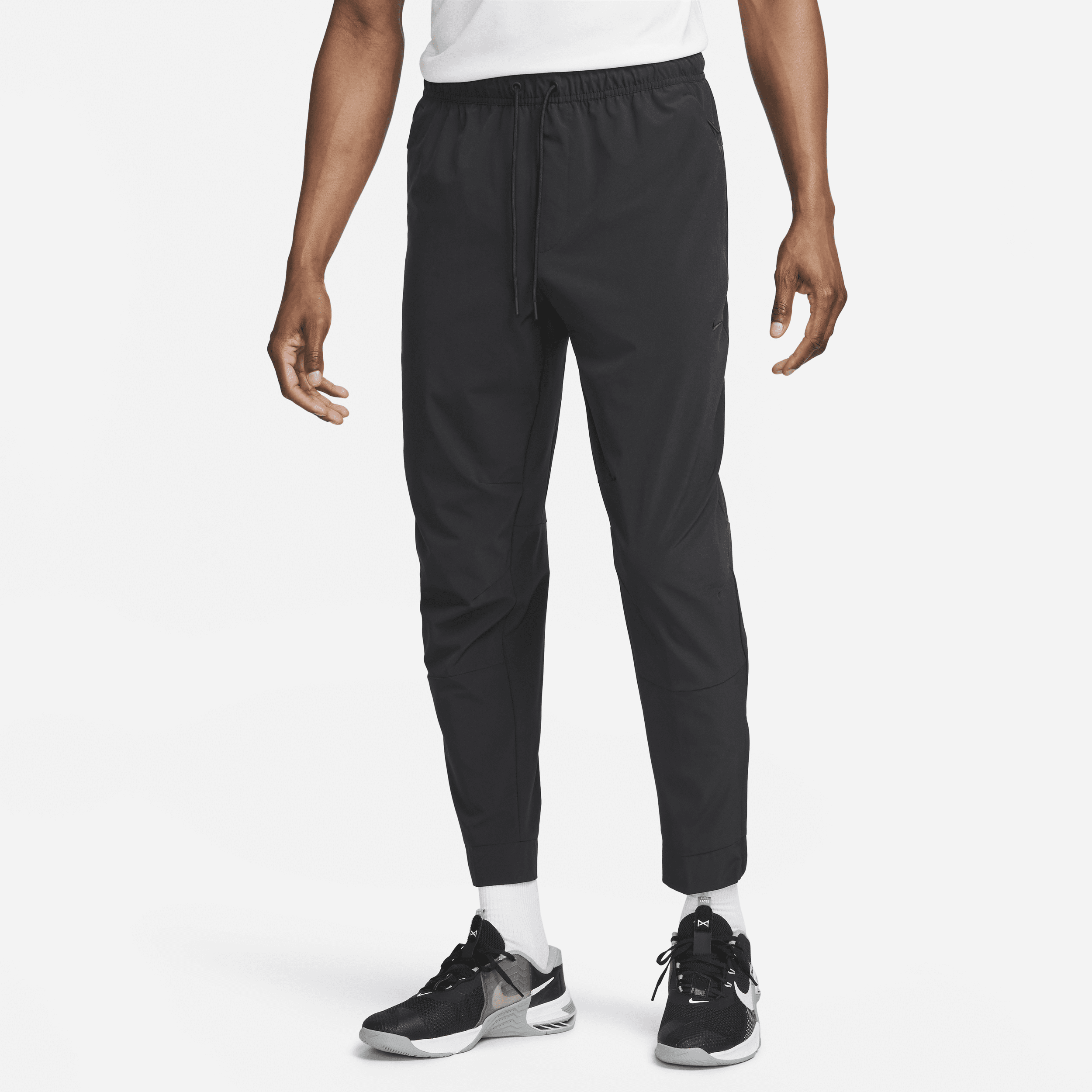 Alsidige Nike Unlimited-Dri-FIT-bukser med lynlåsmanchetter til mænd - sort