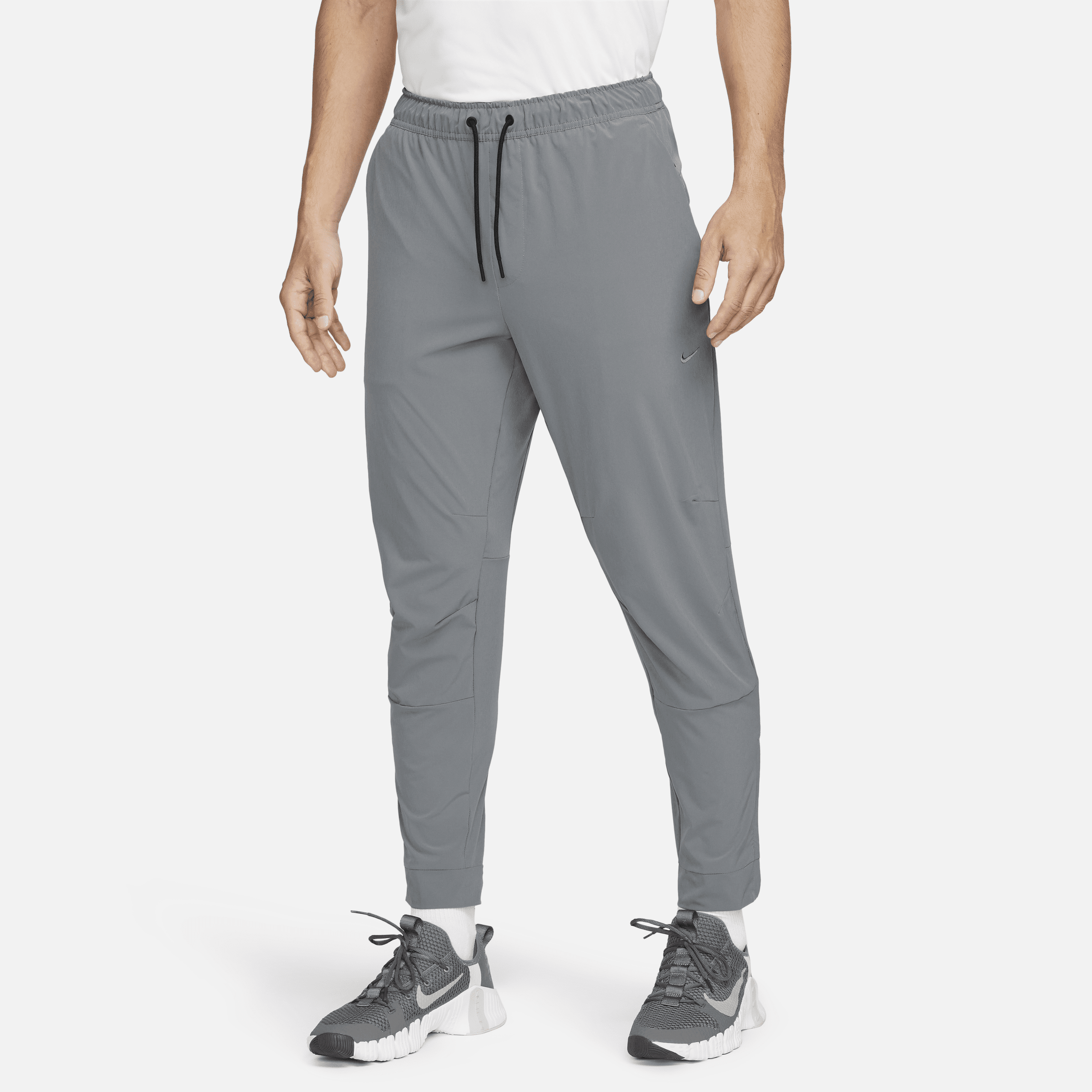 Alsidige Nike Unlimited-Dri-FIT-bukser med lynlåsmanchetter til mænd - grå