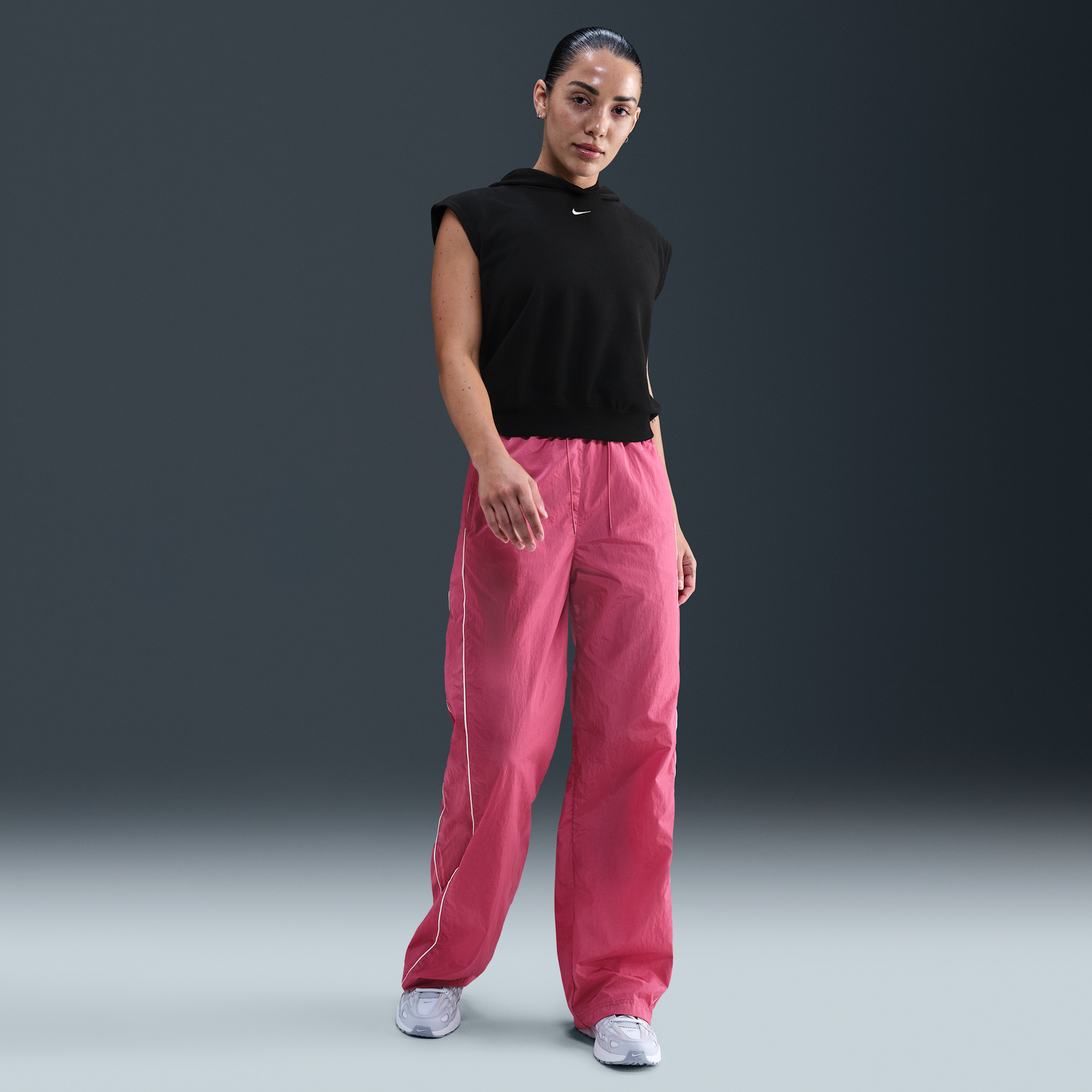 Pantaloni in tessuto a vita alta con bordo aperto Nike Windrunner – Donna - Viola