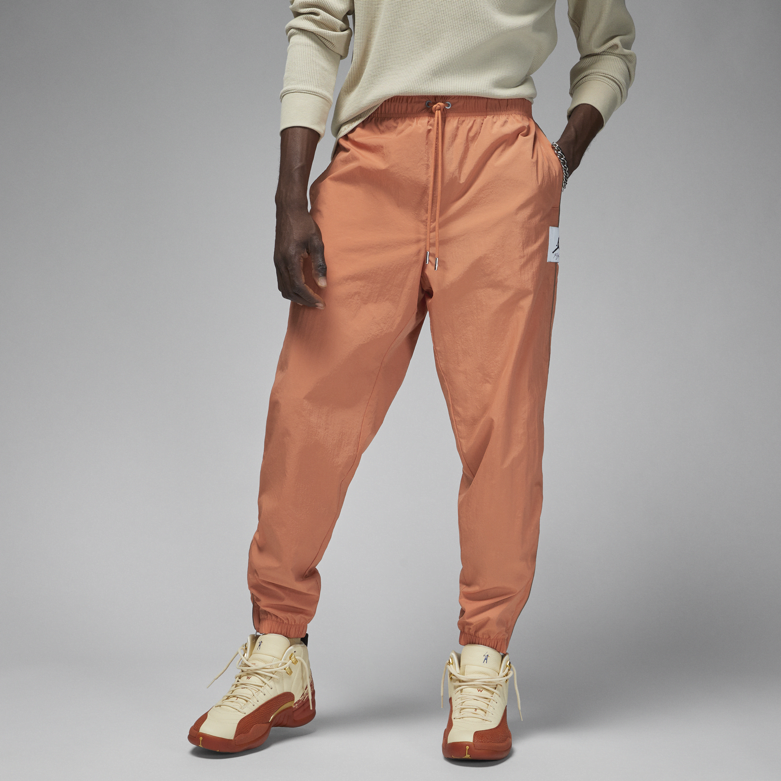 Jordan Essentials-opvarmningsbukser til mænd - Orange