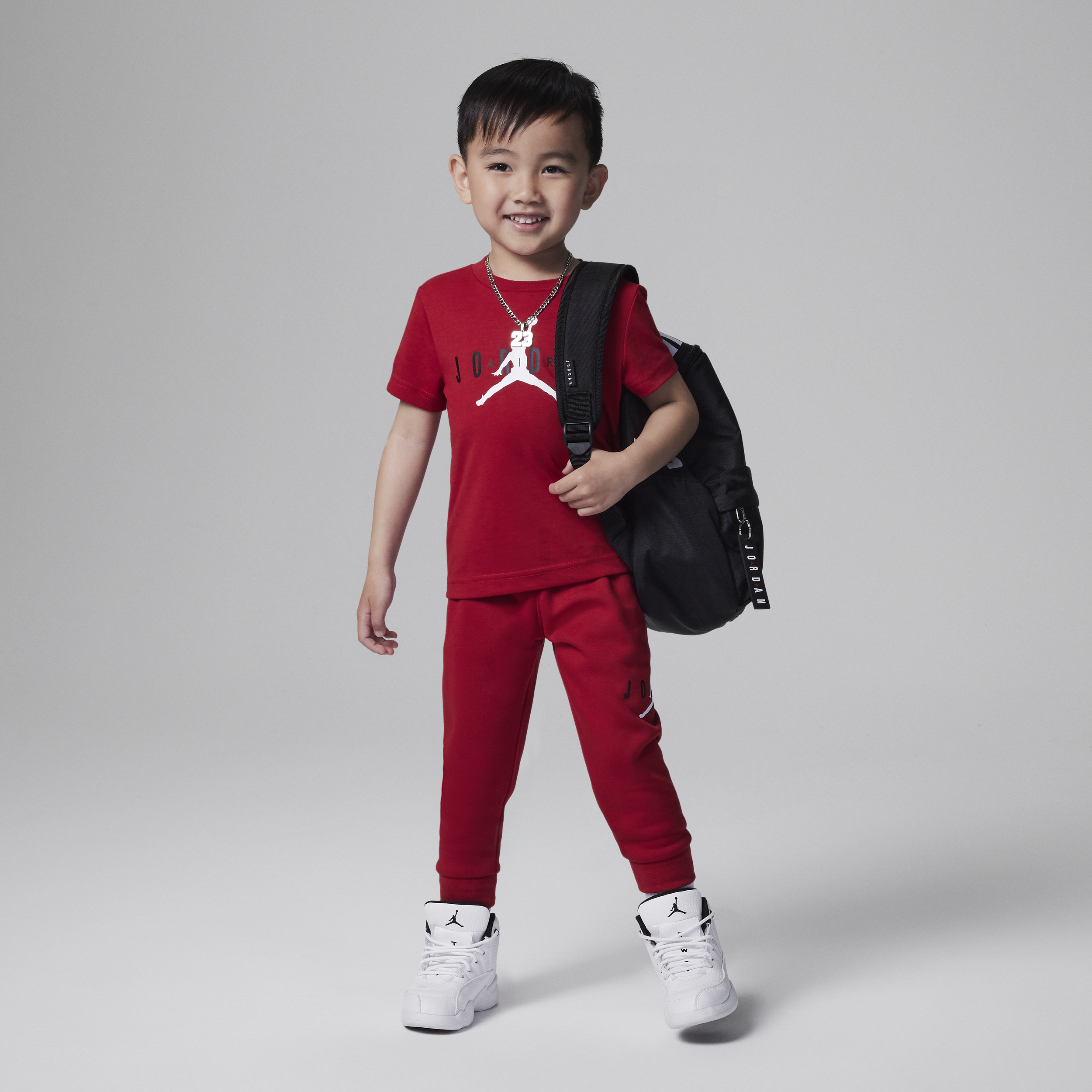 Nike Bæredygtigt sæt med Jordan Jumpman-bukser til småbørn - rød