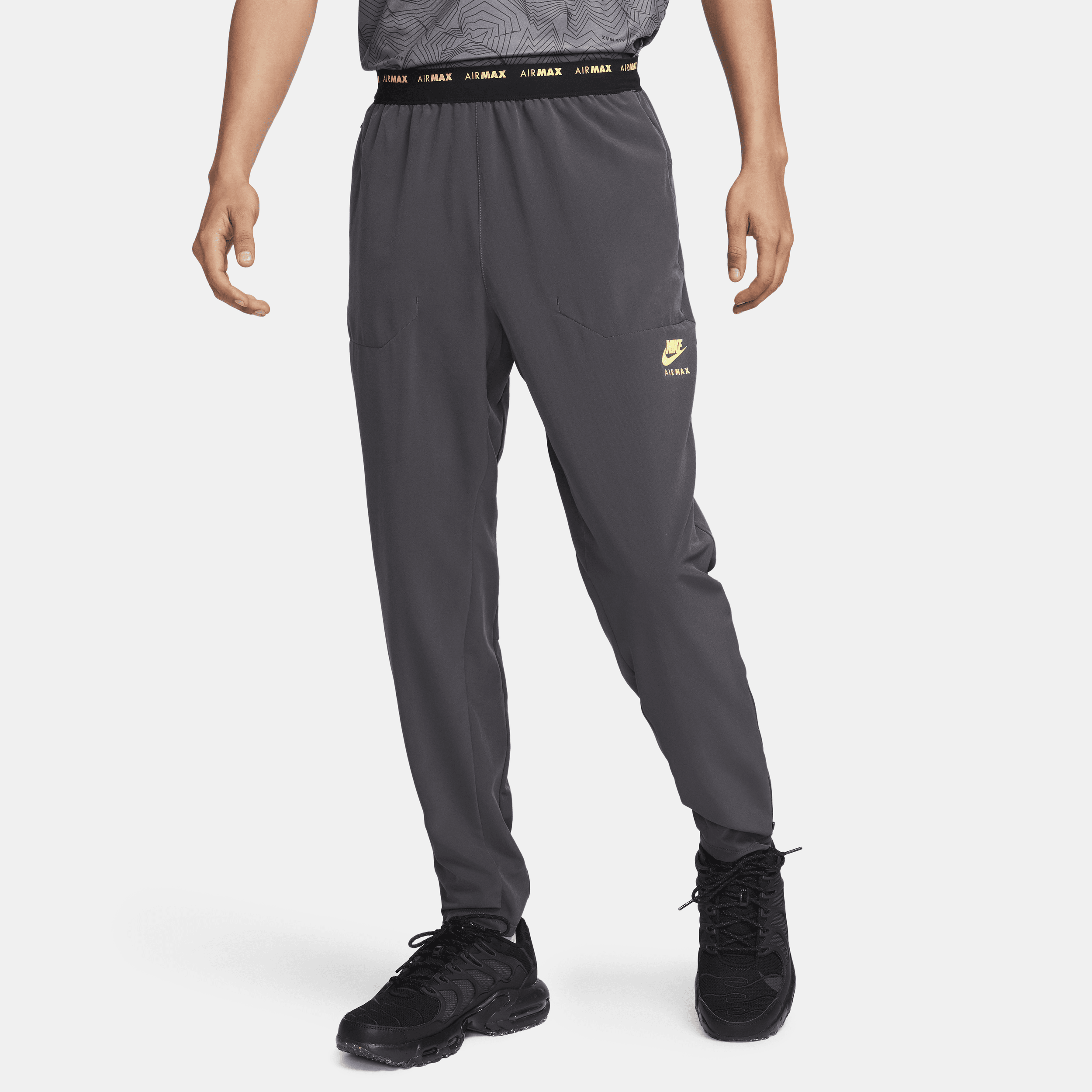 Pantaloni in tessuto Dri-FIT Nike Air Max – Uomo - Grigio