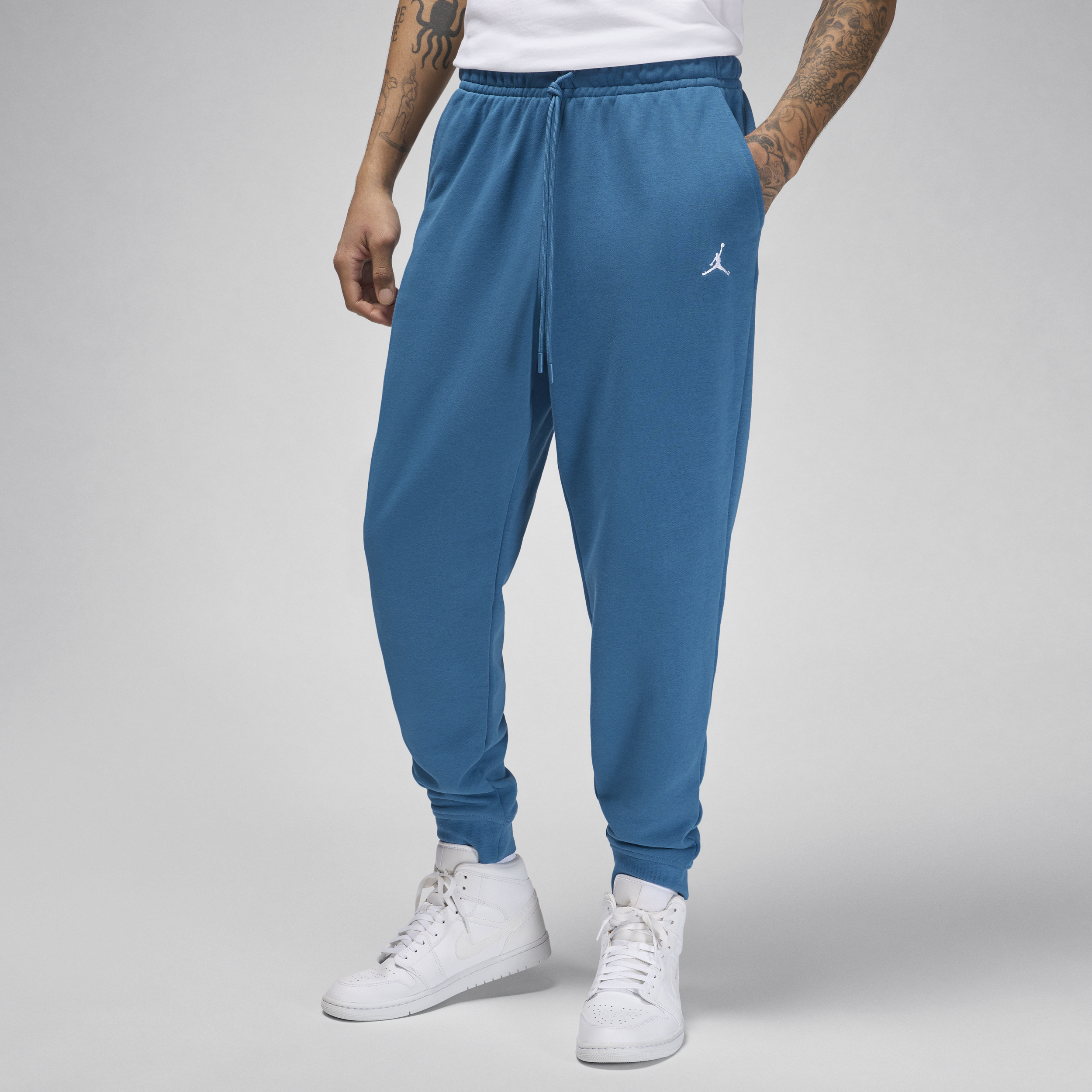Jordan Essentials-bukser med loopback-fleece og grafik til mænd - blå