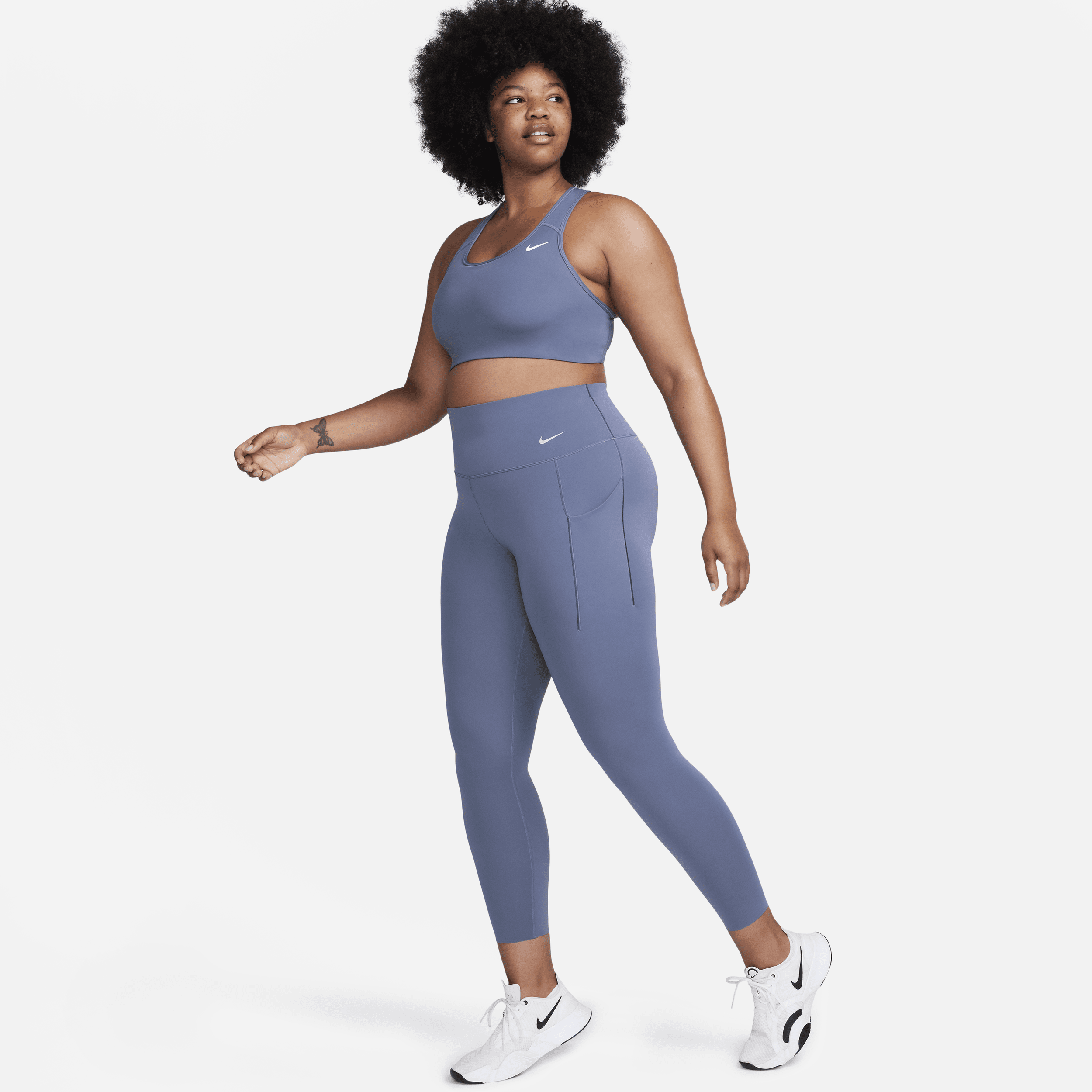 Nike Universa Leggings de 7/8 de talle alto y sujeción media con bolsillos - Mujer - Azul