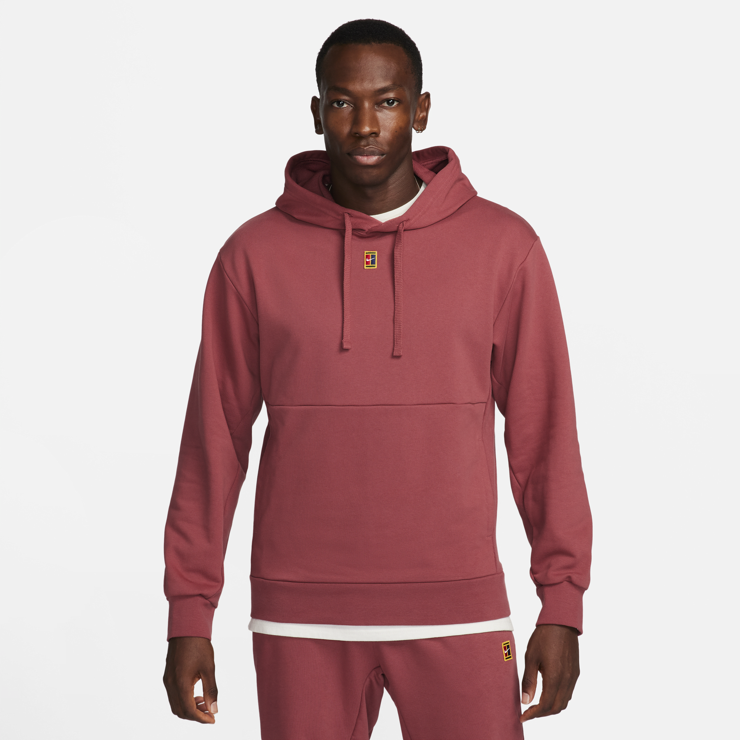 NikeCourt-tennishættetrøje i fleece til mænd - rød