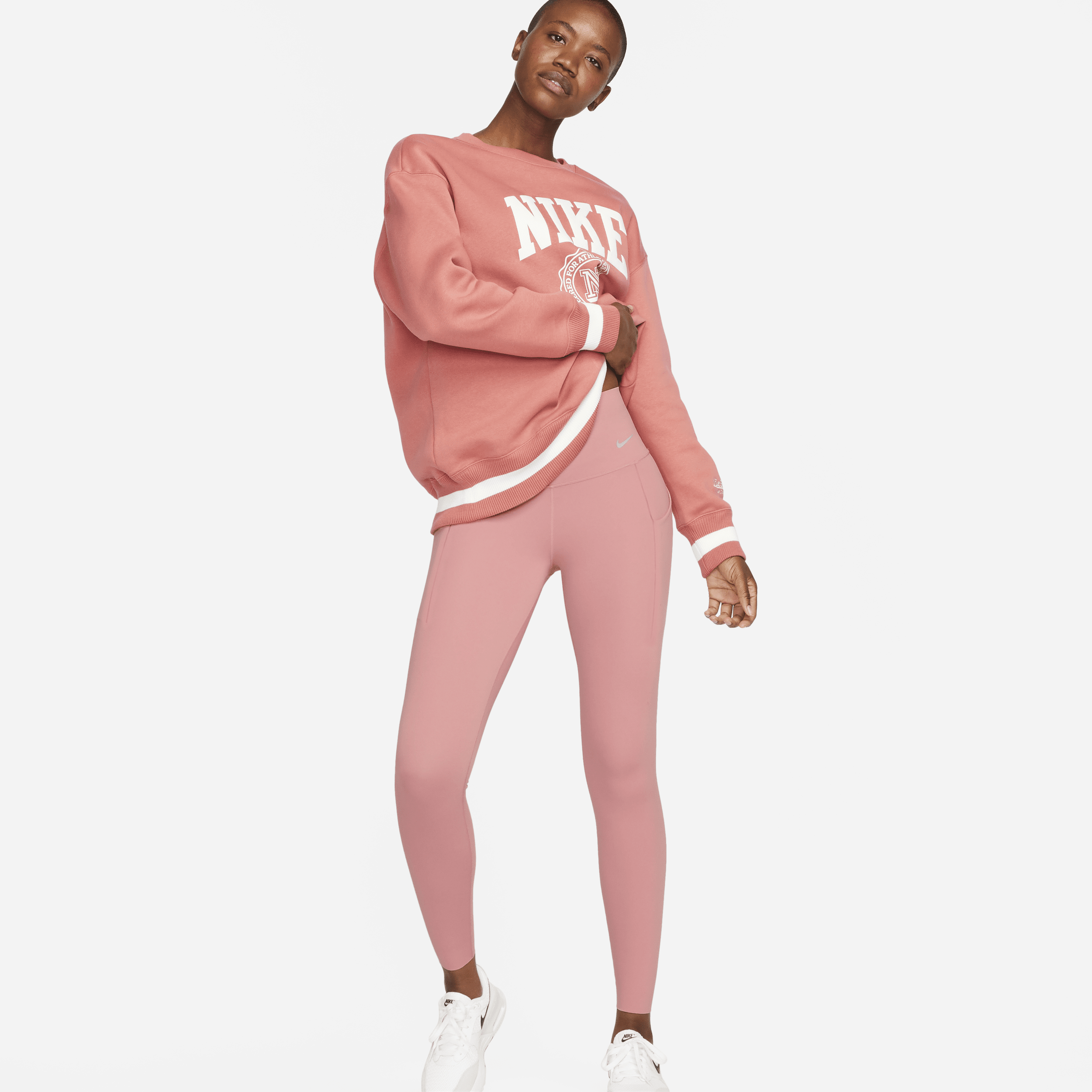 Nike Universa-leggings i fuld længde med medium støtte, høj talje og lommer til kvinder - Pink