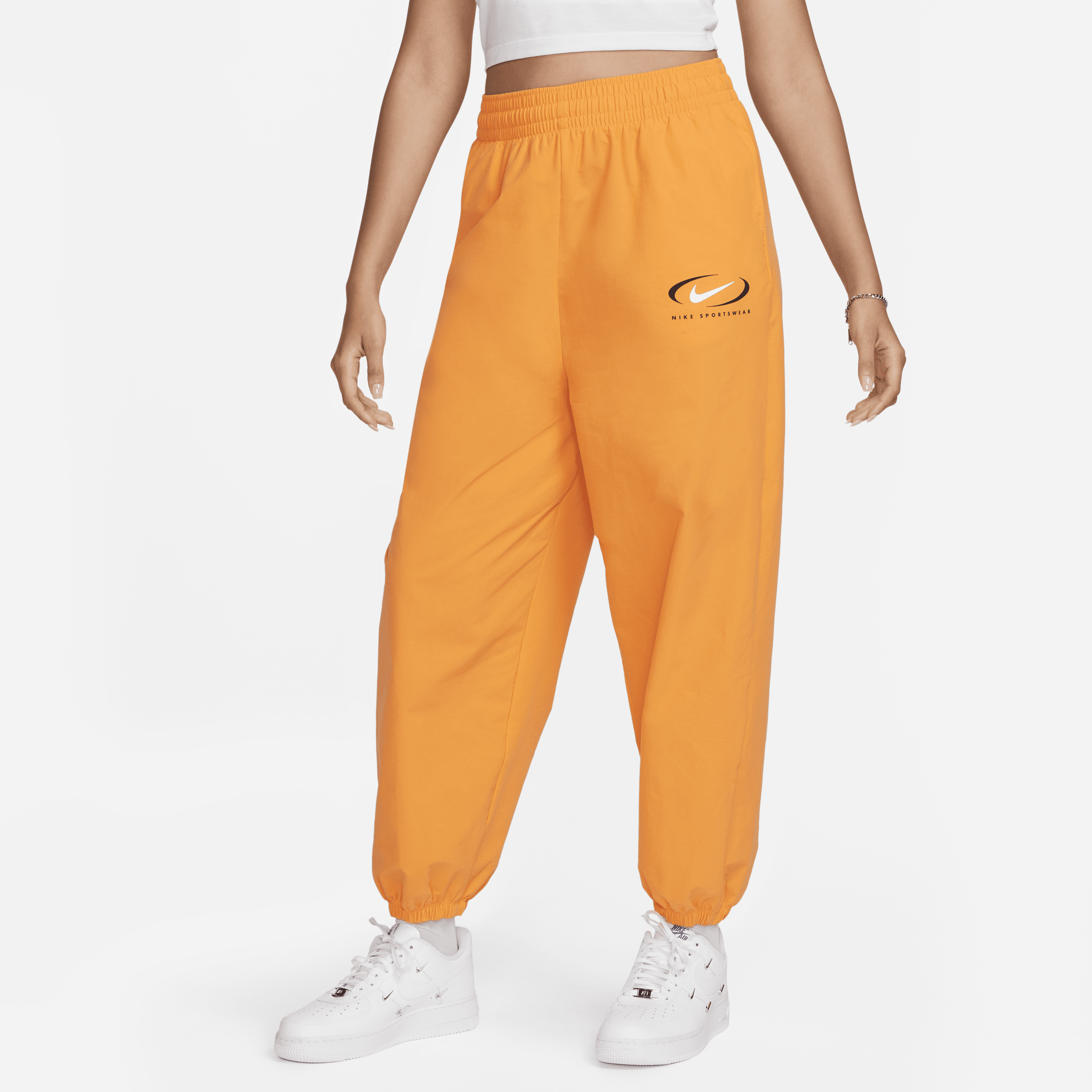 Nike Sportswear geweven joggingbroek voor dames - Oranje