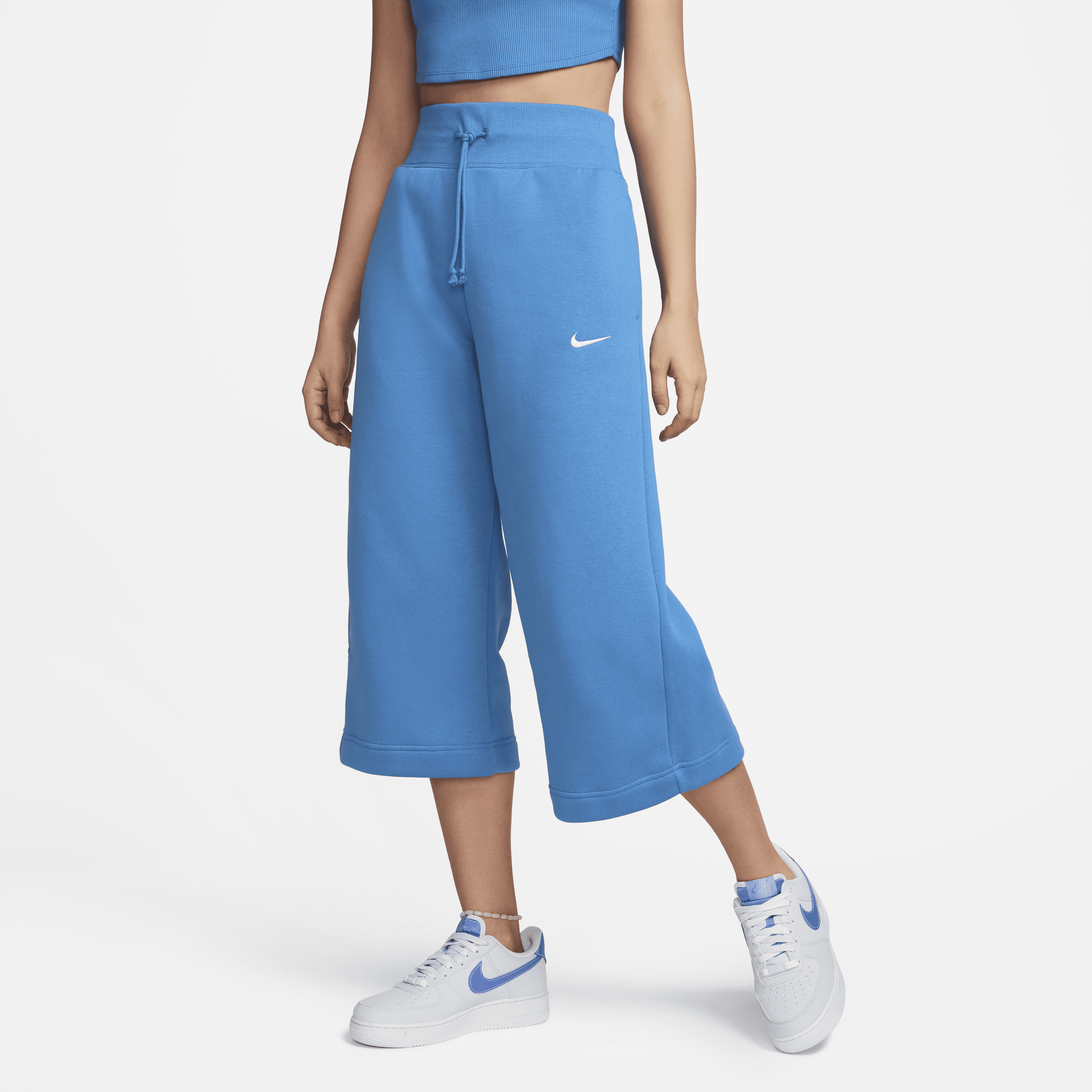 Pantaloni tuta a vita alta e lunghezza ridotta Nike Sportswear Phoenix Fleece – Donna - Blu