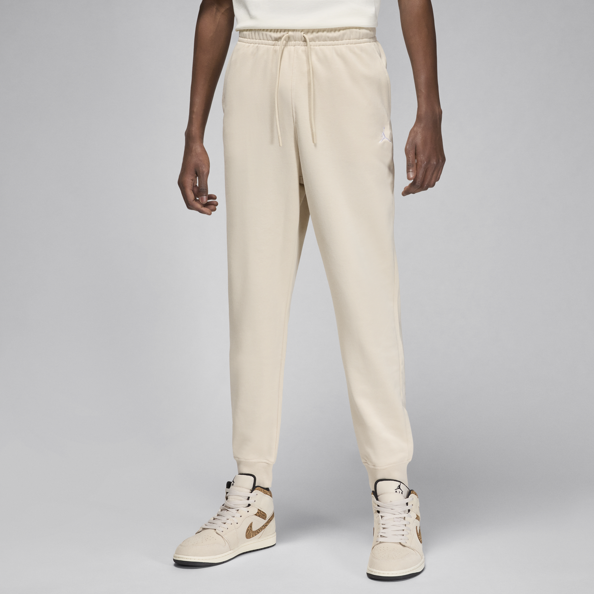 Jordan Essentials-bukser med loopback-fleece og grafik til mænd - brun