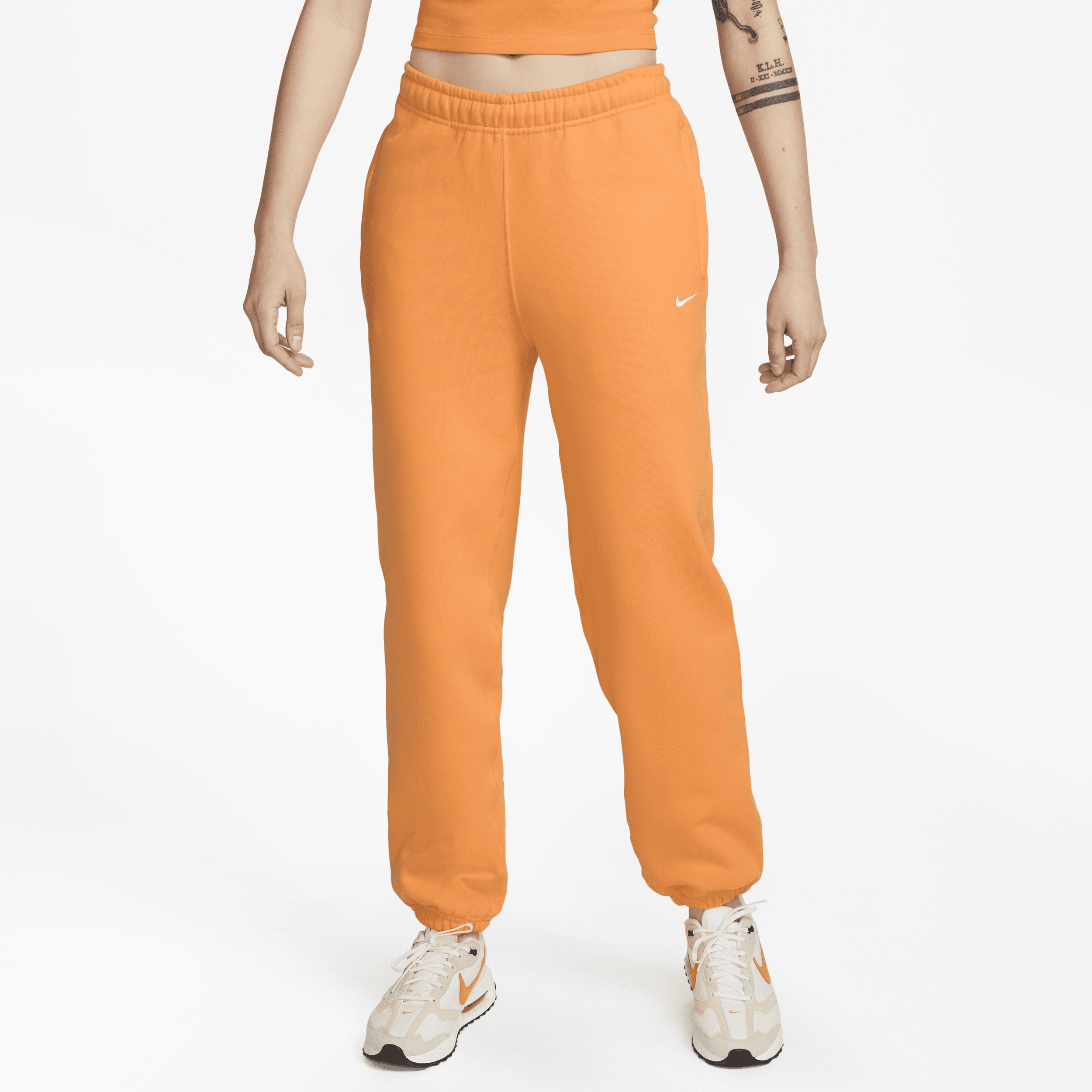 Nike Solo Swoosh-fleecebukser til kvinder - Orange
