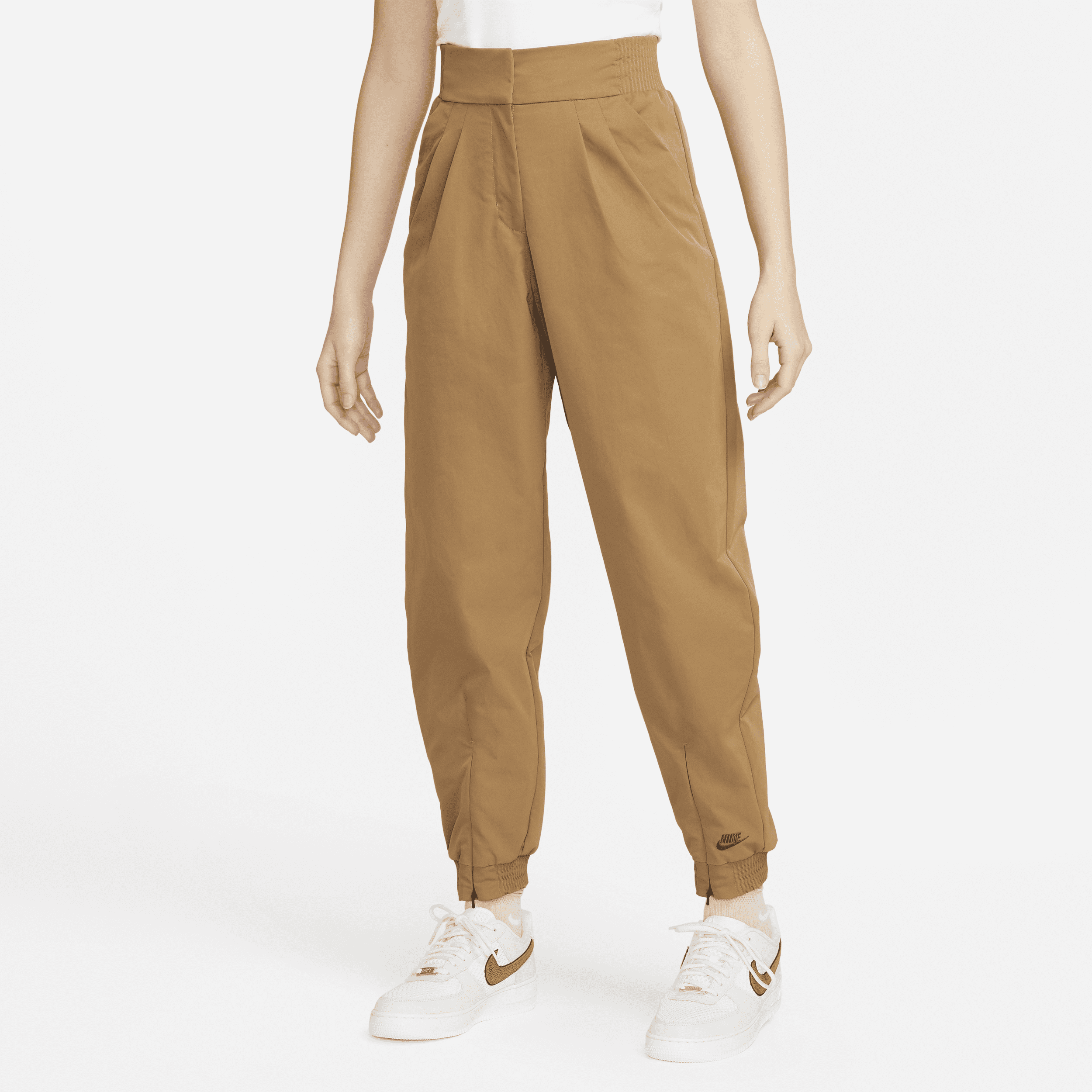 Nike Sportswear Dri-FIT Tech Pack-bukser med høj talje til kvinder - brun