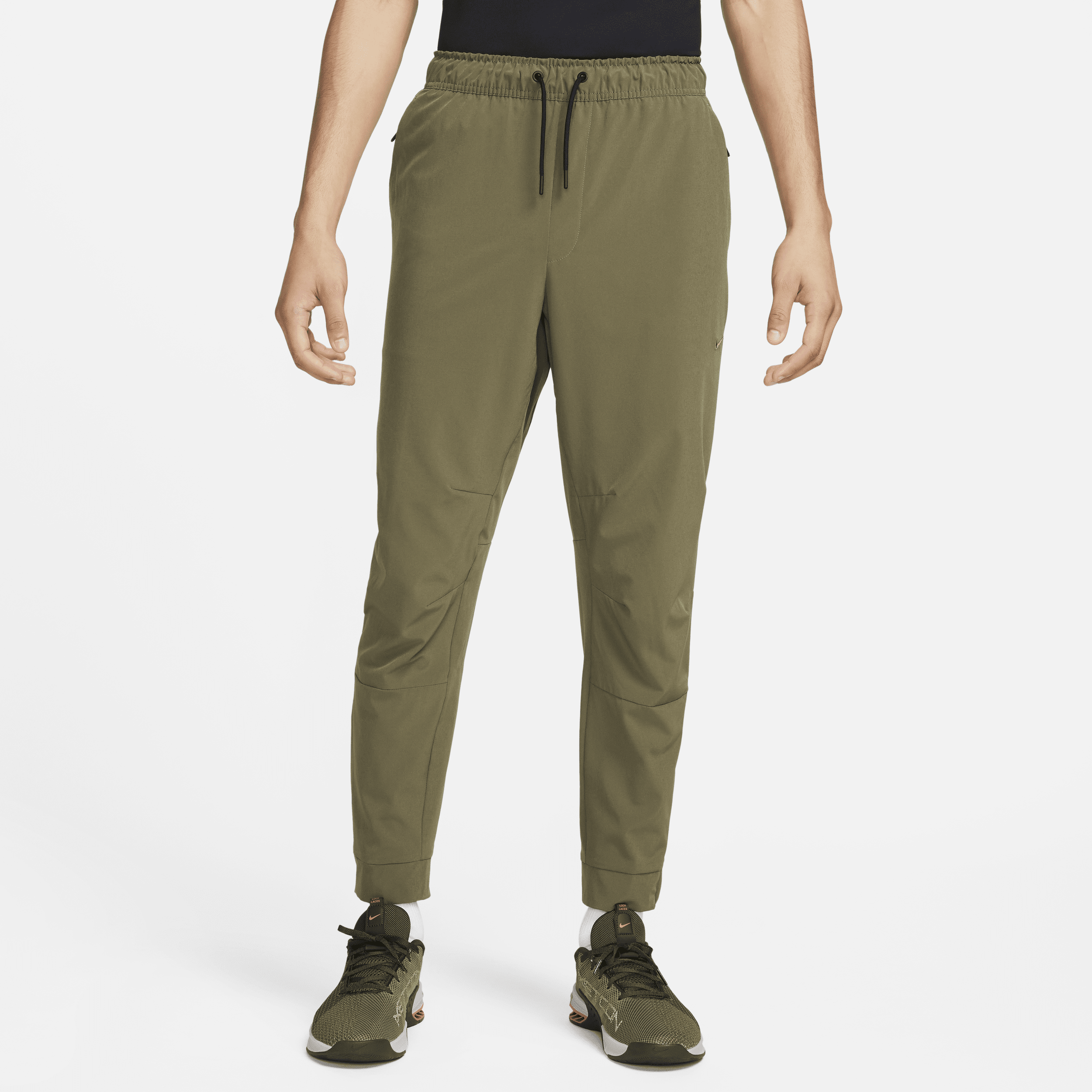 Alsidige Nike Unlimited-Dri-FIT-bukser med lynlåsmanchetter til mænd - grøn