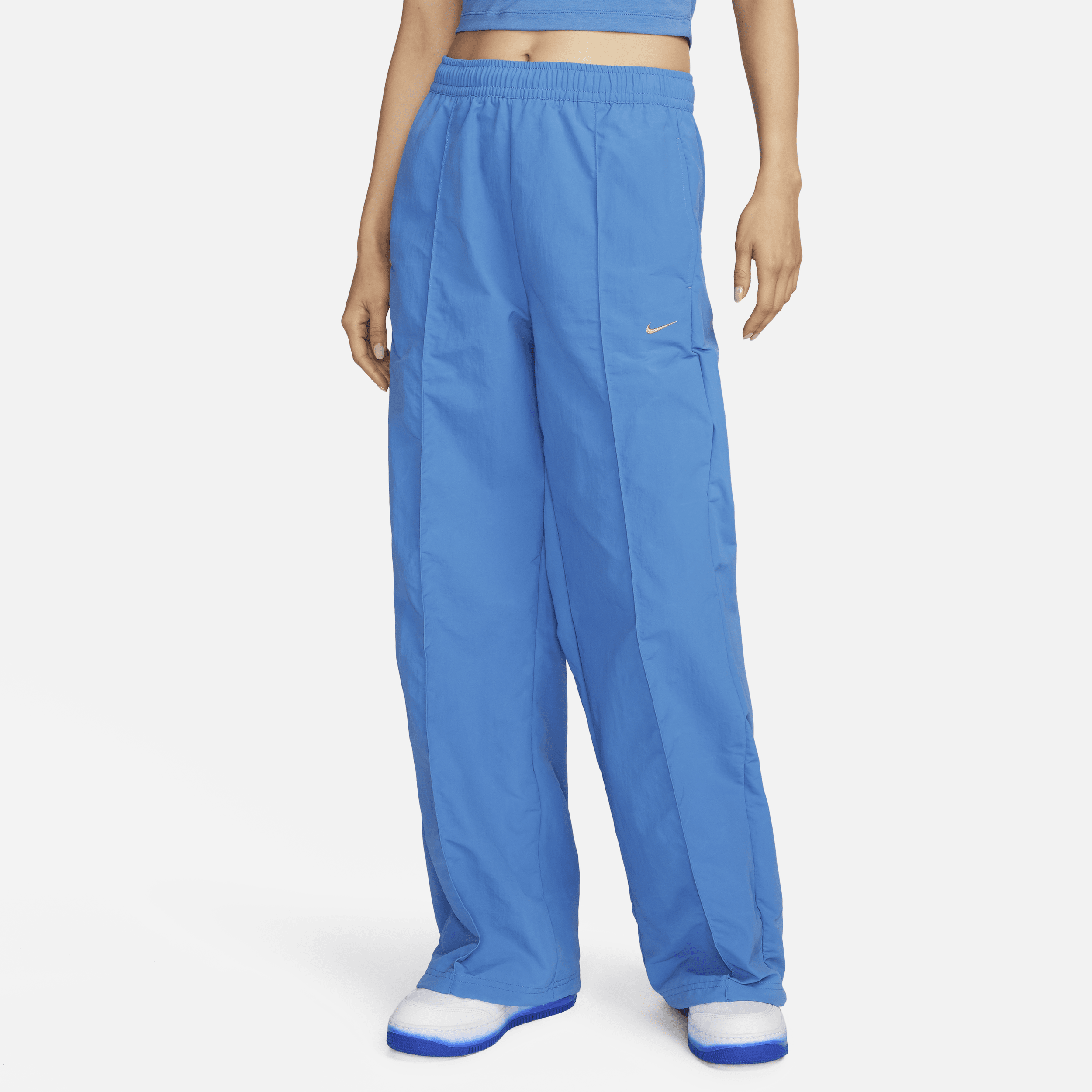 Mellemhøje Nike Sportswear Everything Wovens-bukser med åben kant til kvinder - blå