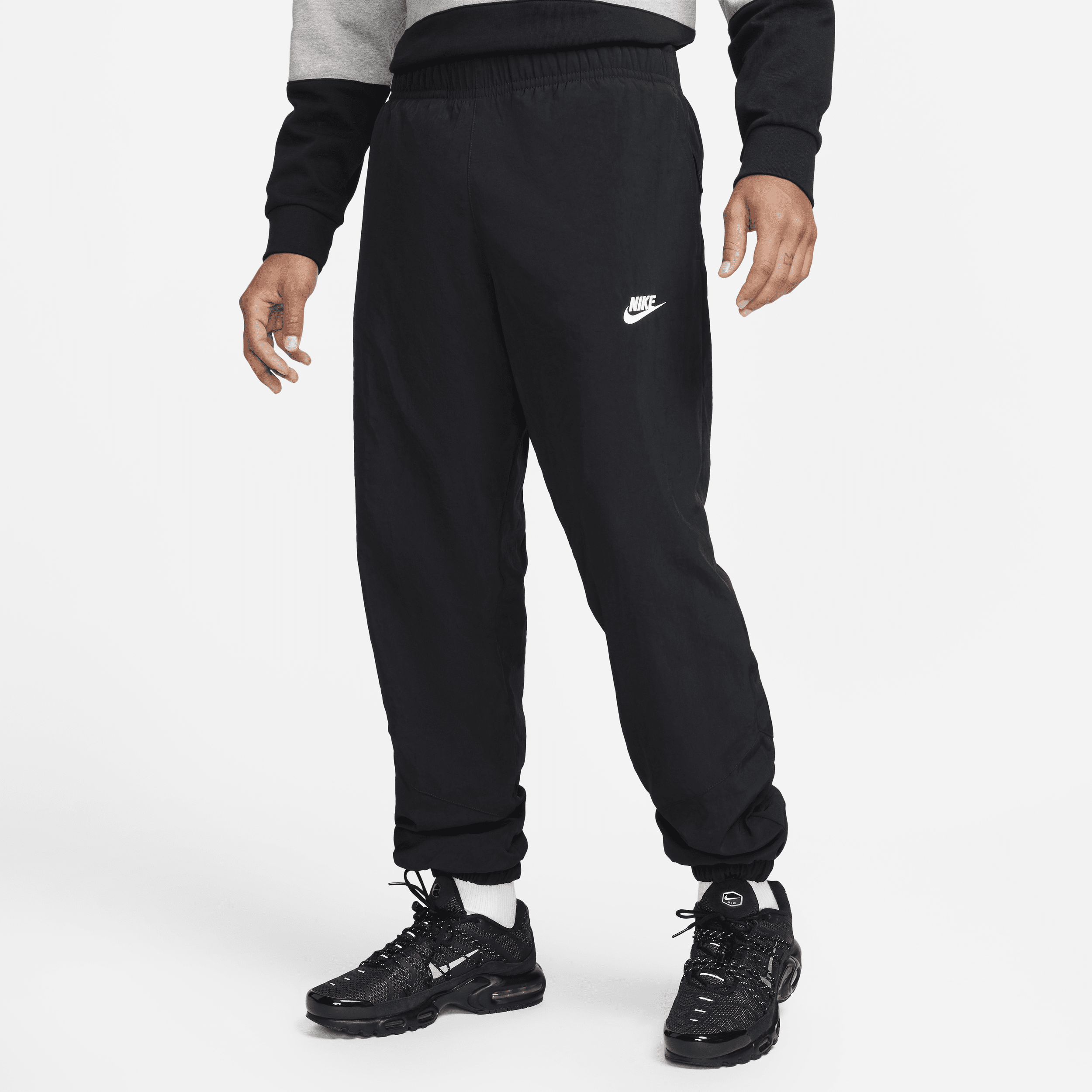 Pantaloni in tessuto per l'inverno Nike Windrunner – Uomo - Nero